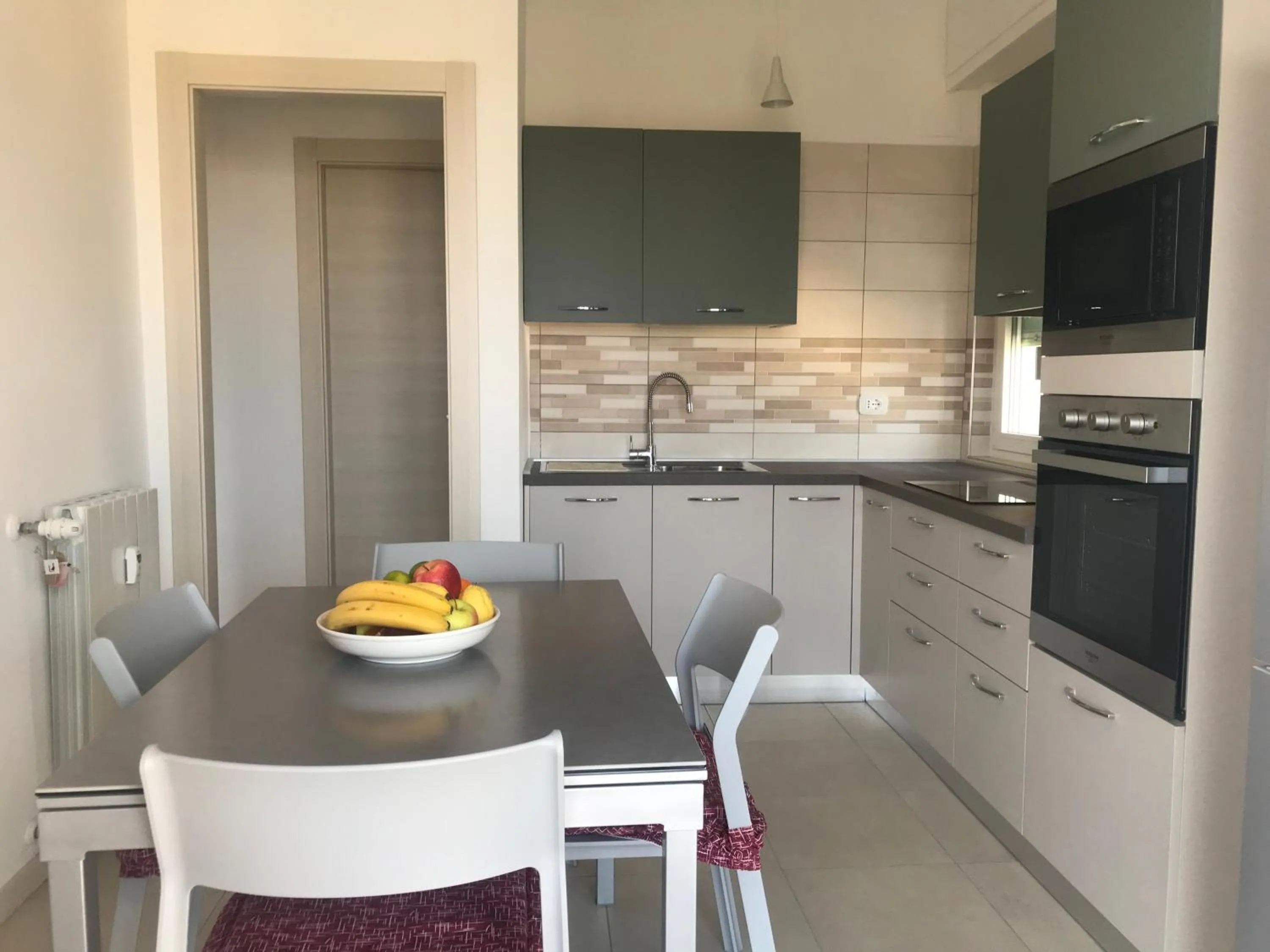 Kitchen or kitchenette in Appartamento Bianco by Holiday World