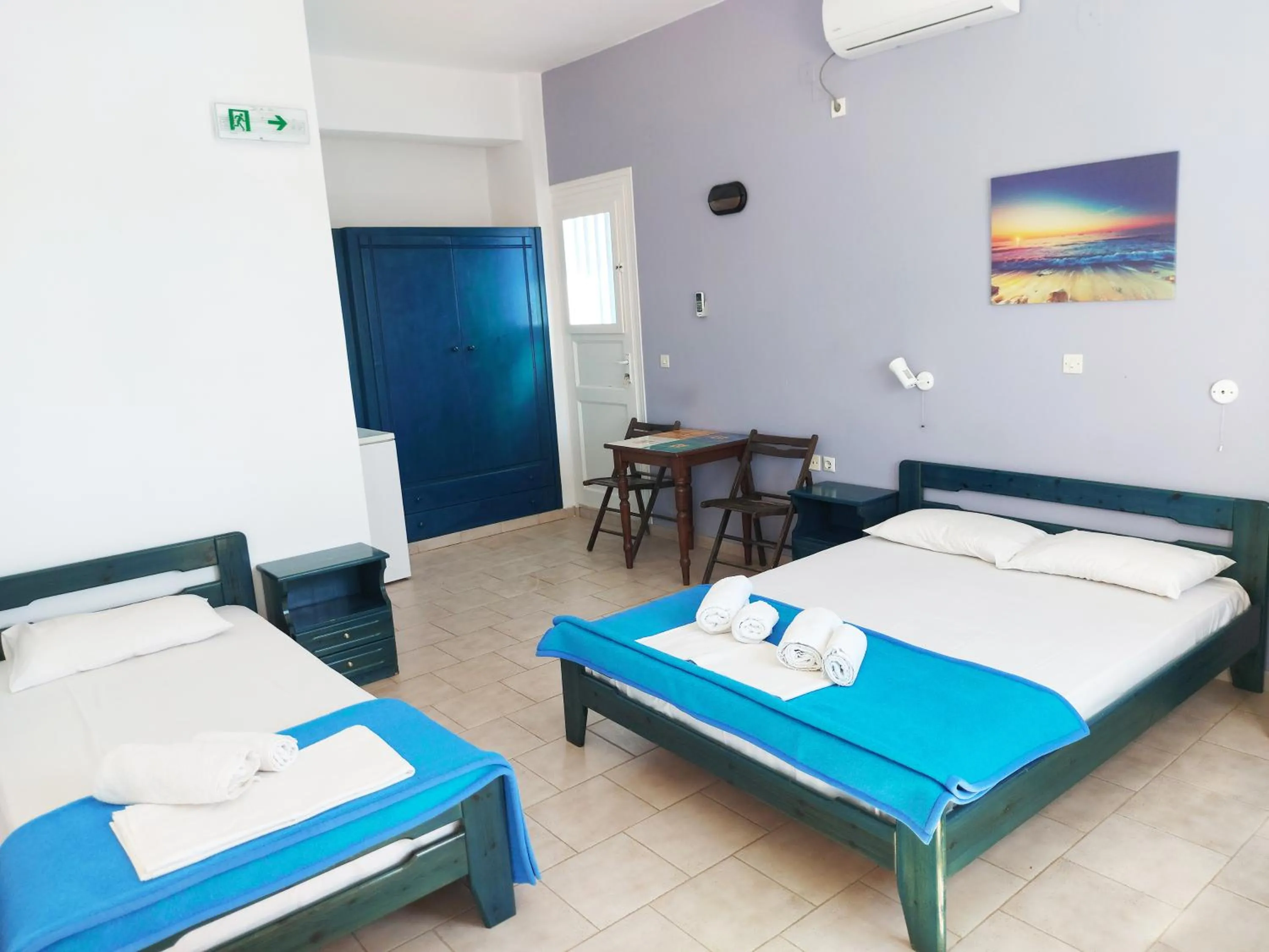 Bed in Aigaio View Studios & Rooms