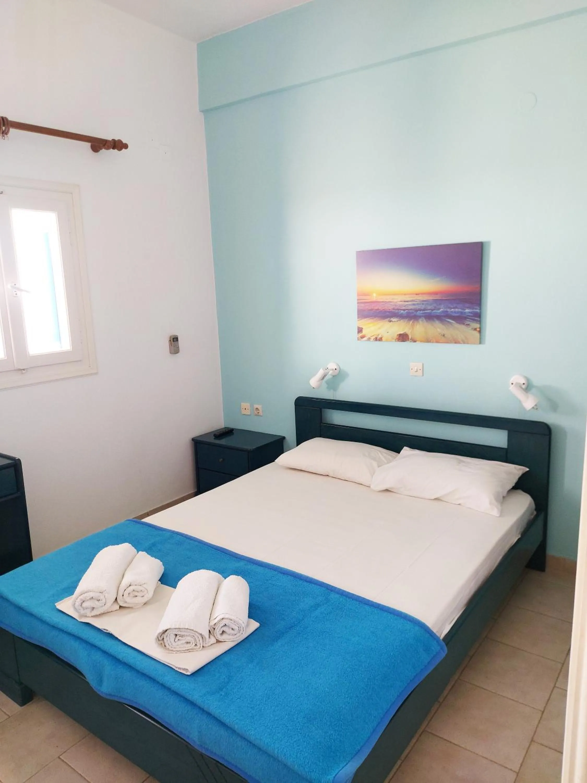 Bed in Aigaio View Studios & Rooms