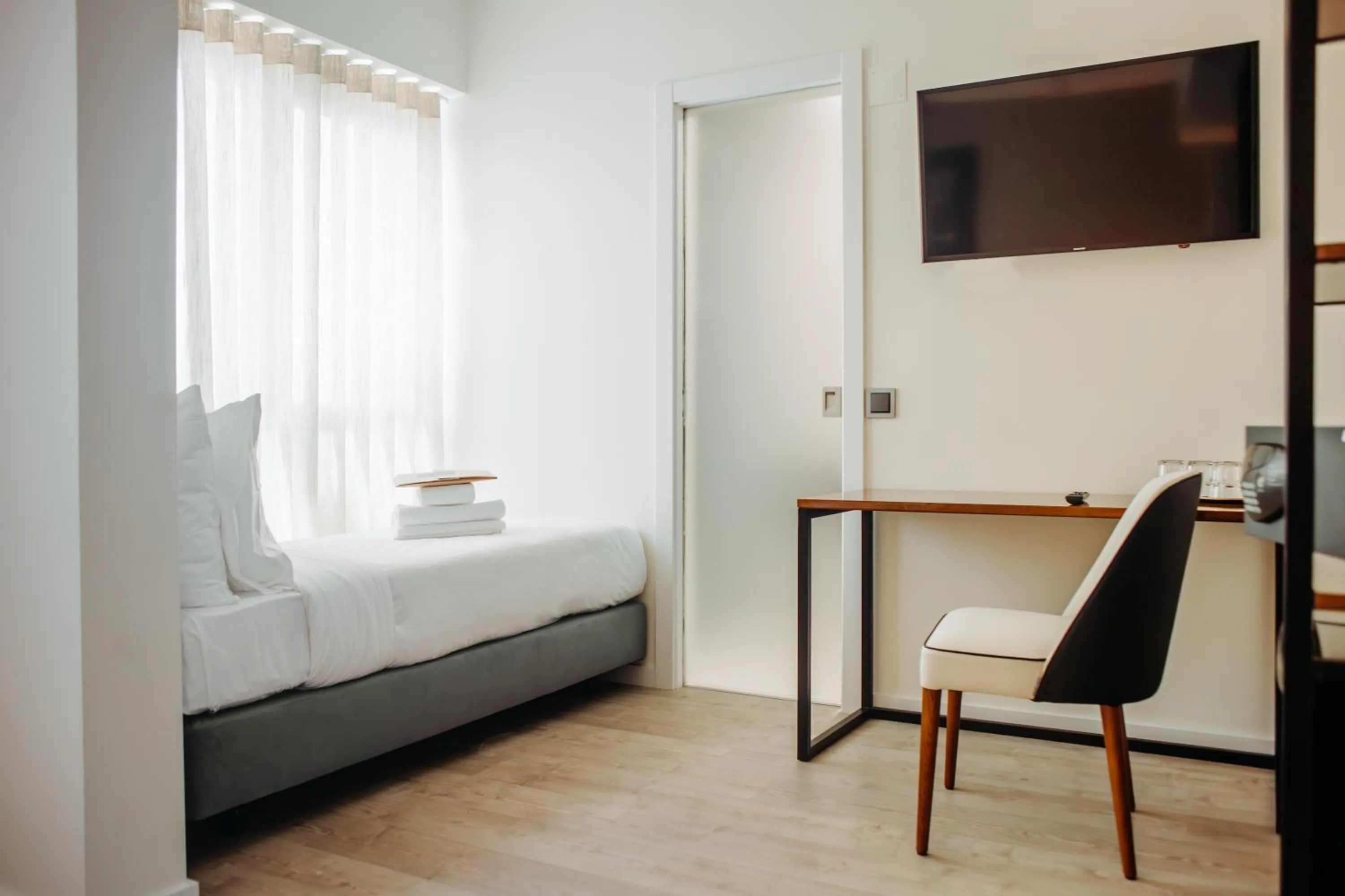 Seating area, Bed in Next Level Premium Hotels