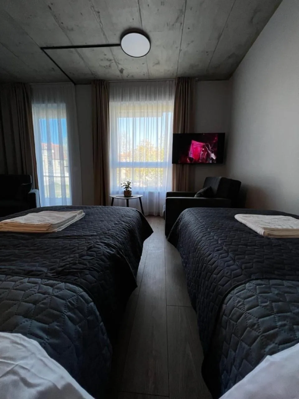 Communal lounge/ TV room, Bed in Tilzes Studio apartaments, Self check-in, Free parking, Comfort