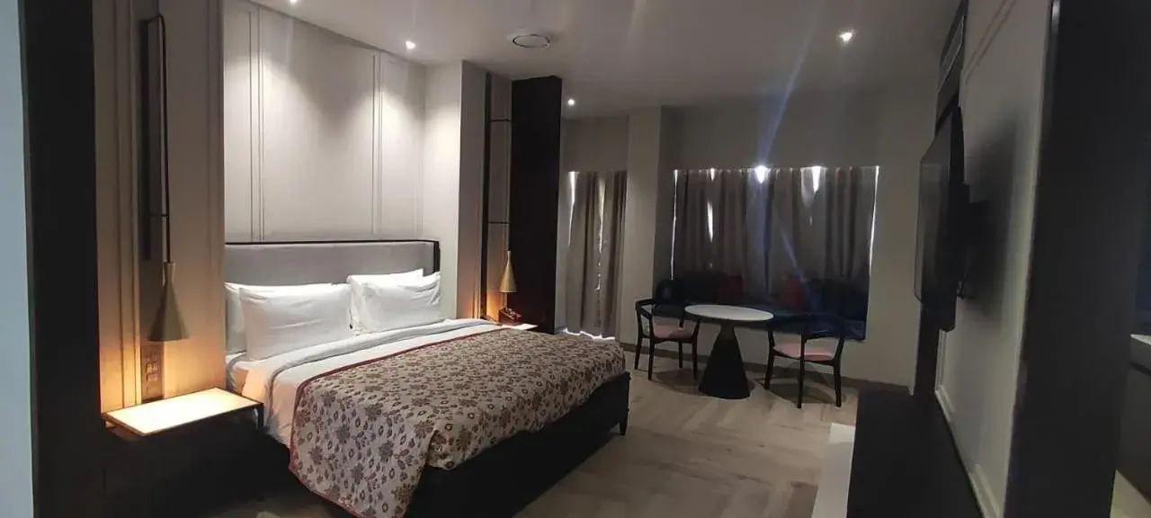 Bed in Pramod Lands End Resort, a member of Radisson Individuals Bed in Pramod Lands End Resort, a member of Radisson Individuals