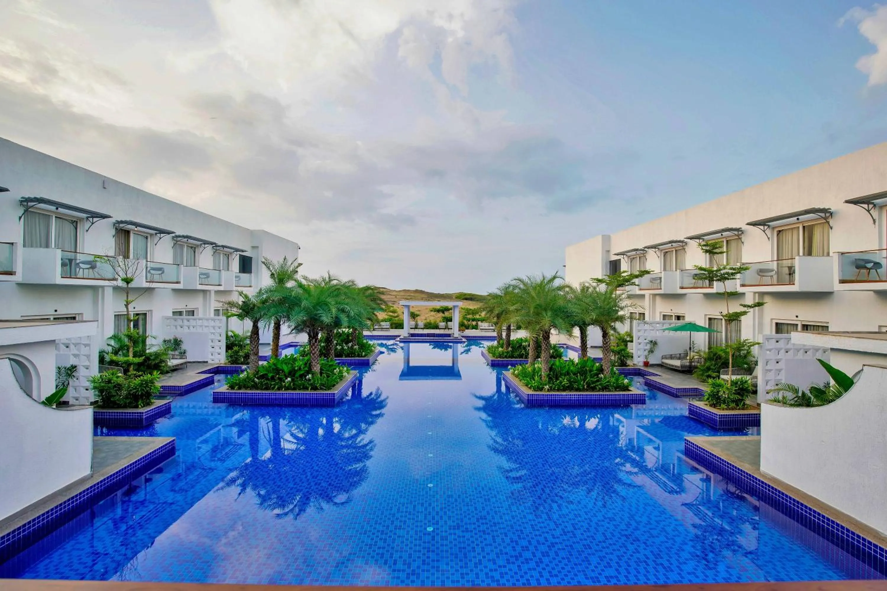Swimming pool in Pramod Lands End Resort, a member of Radisson Individuals