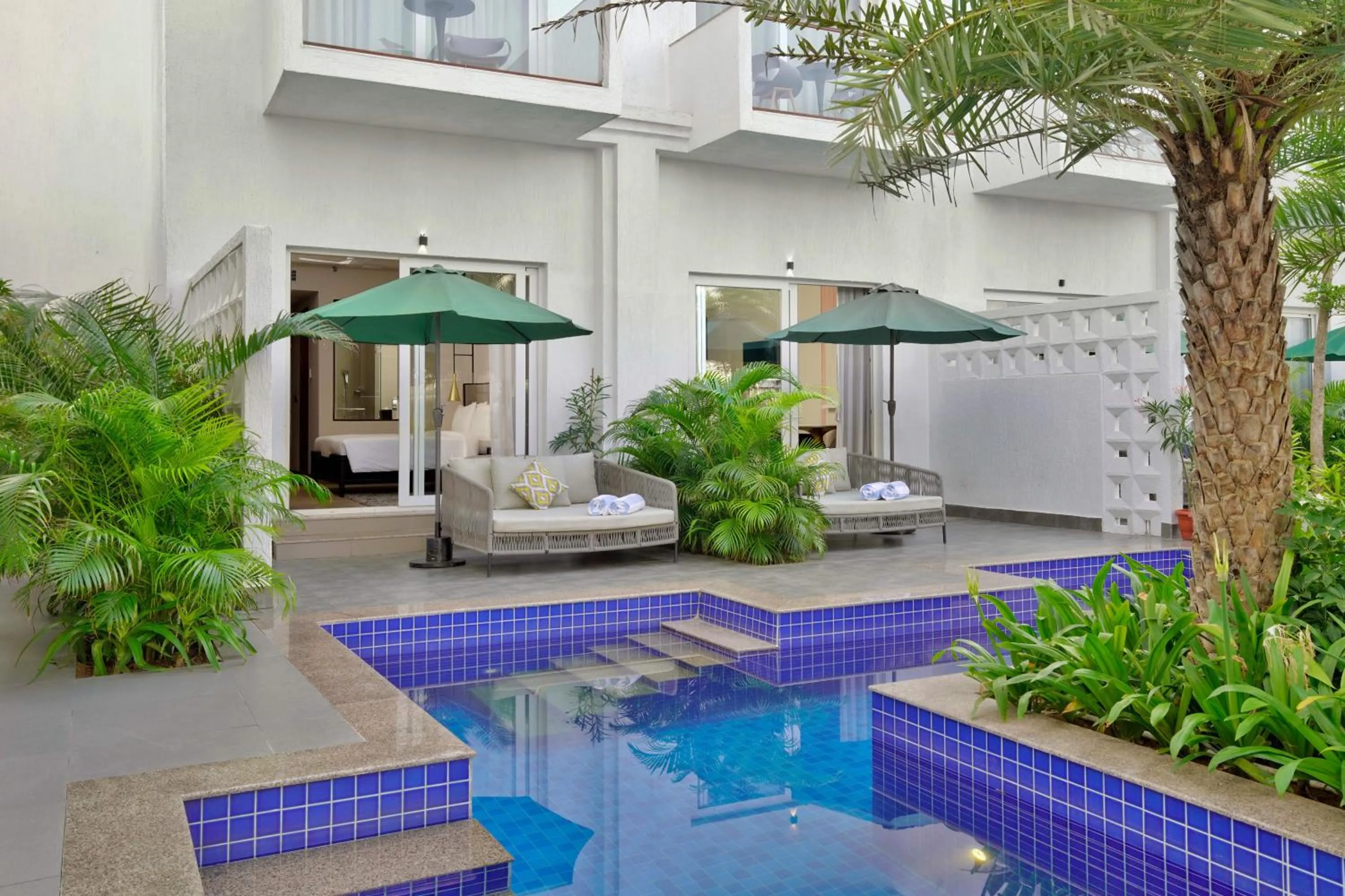Swimming pool in Pramod Lands End Resort, a member of Radisson Individuals