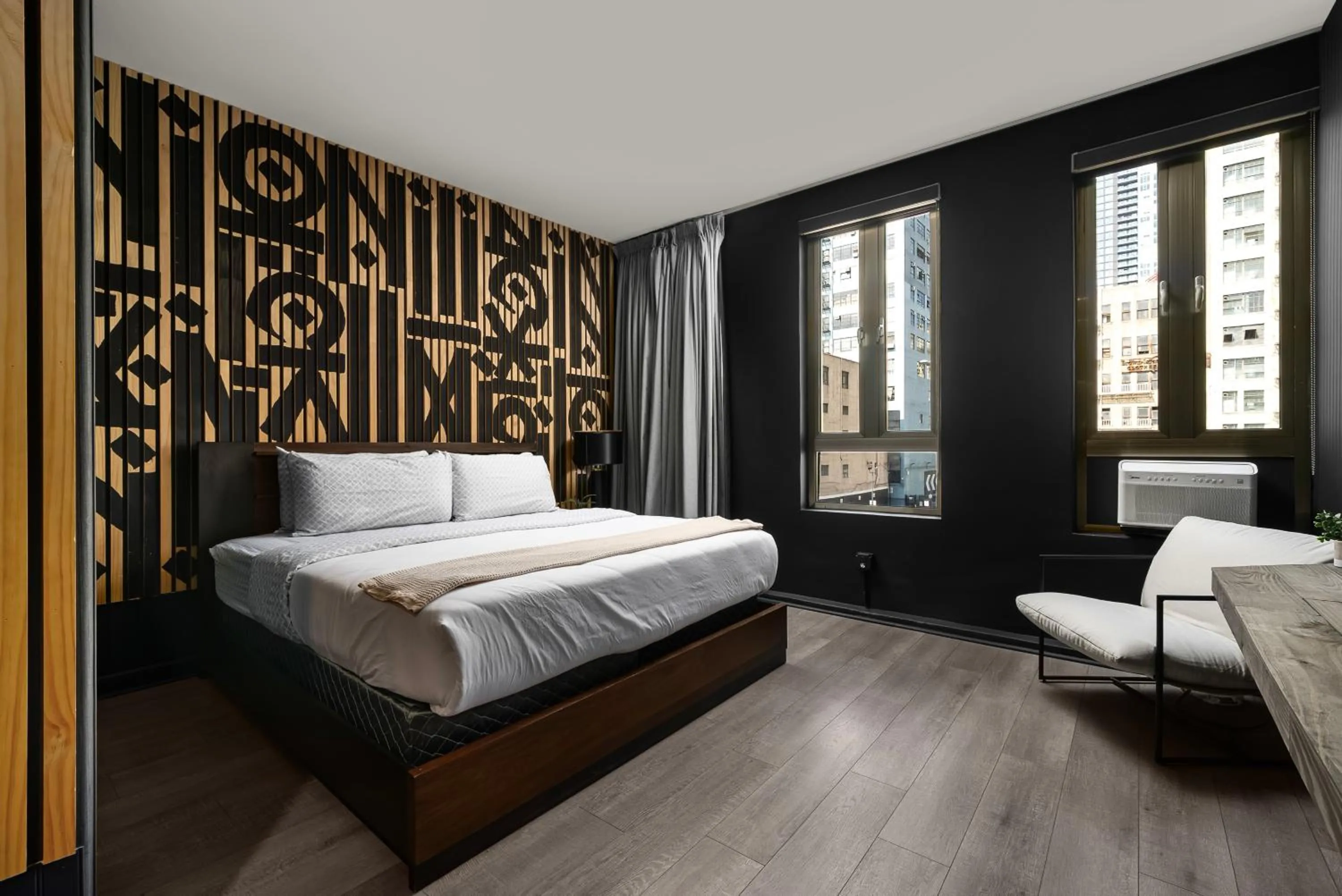 Bed in Audemar Boutique Hotel and Apartment Homes