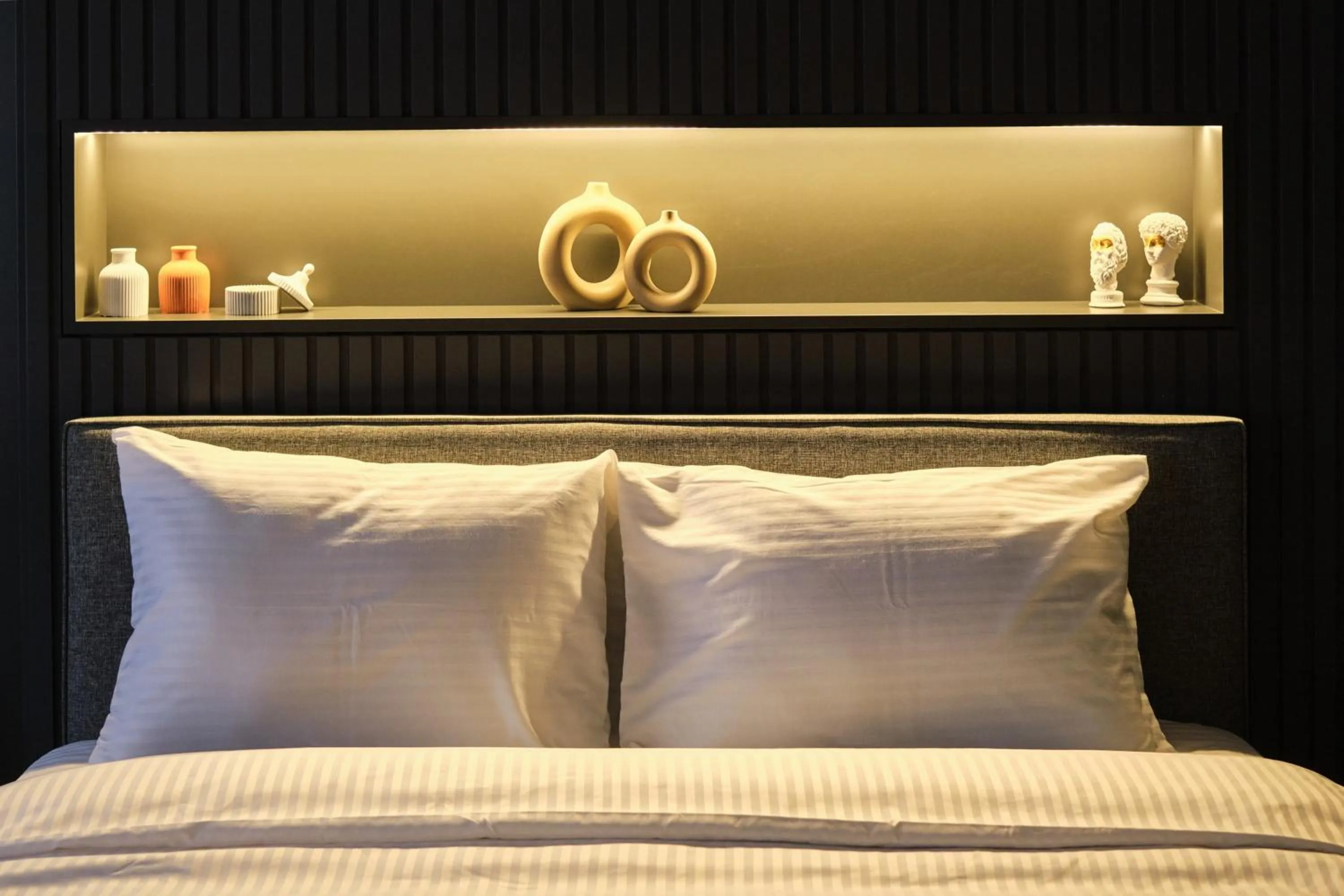 Bed in TAKS-INN Hotel