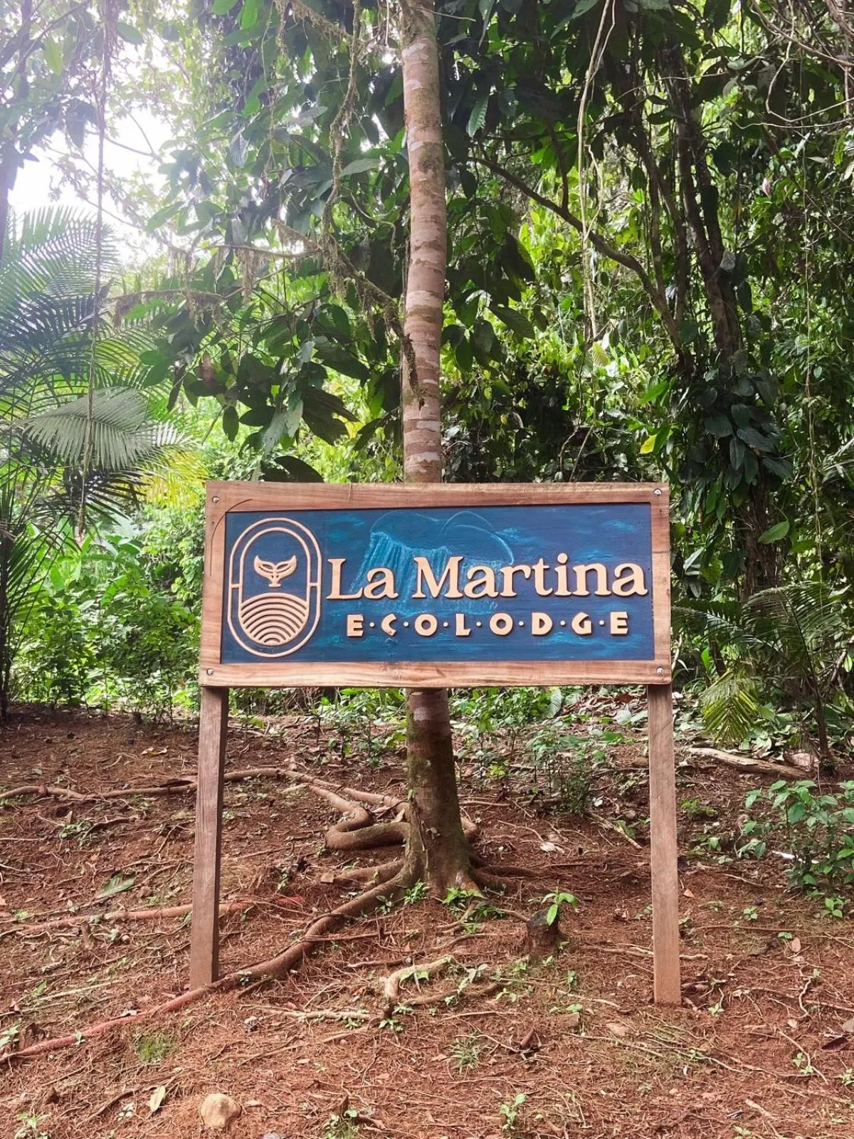 Property logo or sign in La Martina Ecolodge