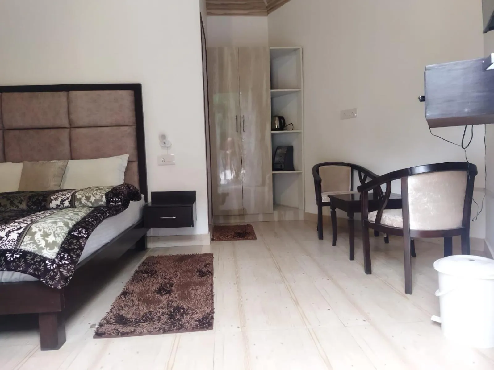 Seating area, Bed in Blossom Bliss Resort