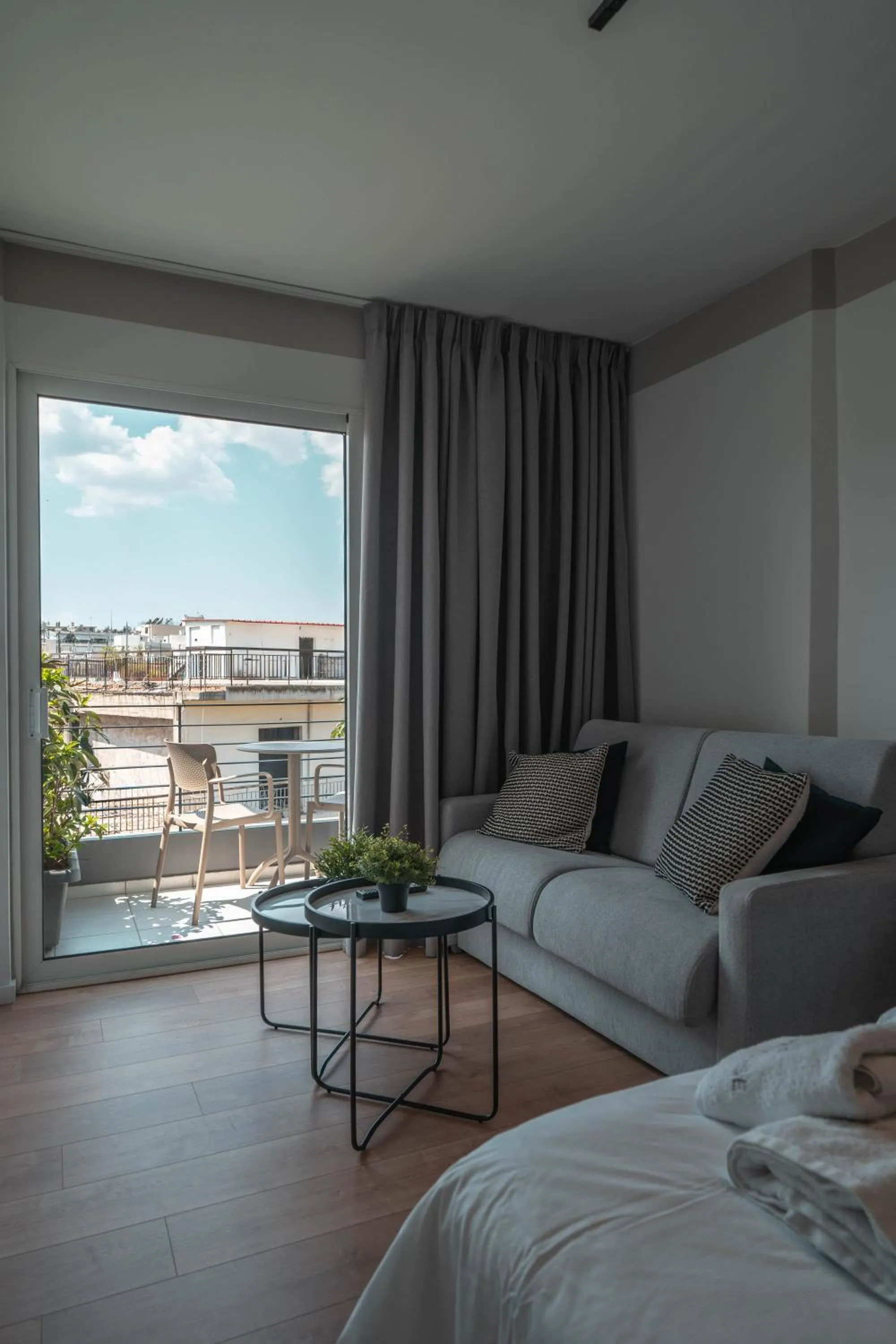 Seating area, Bed in Athesense Suites