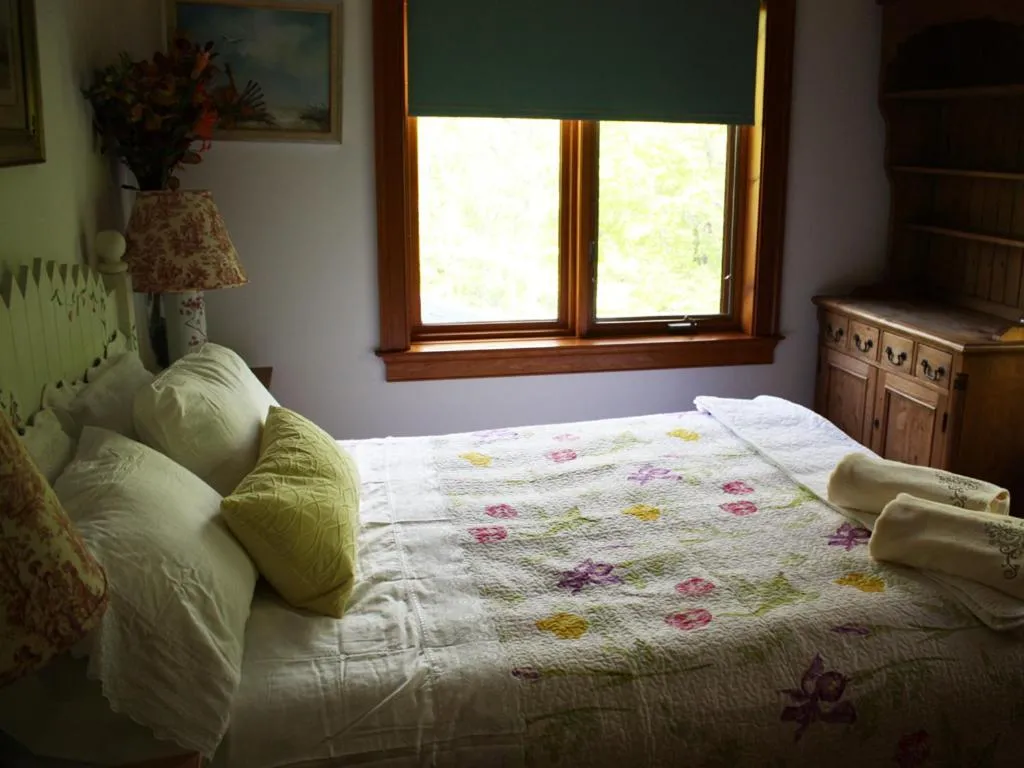 Bed in Honey Maple Grove BnB