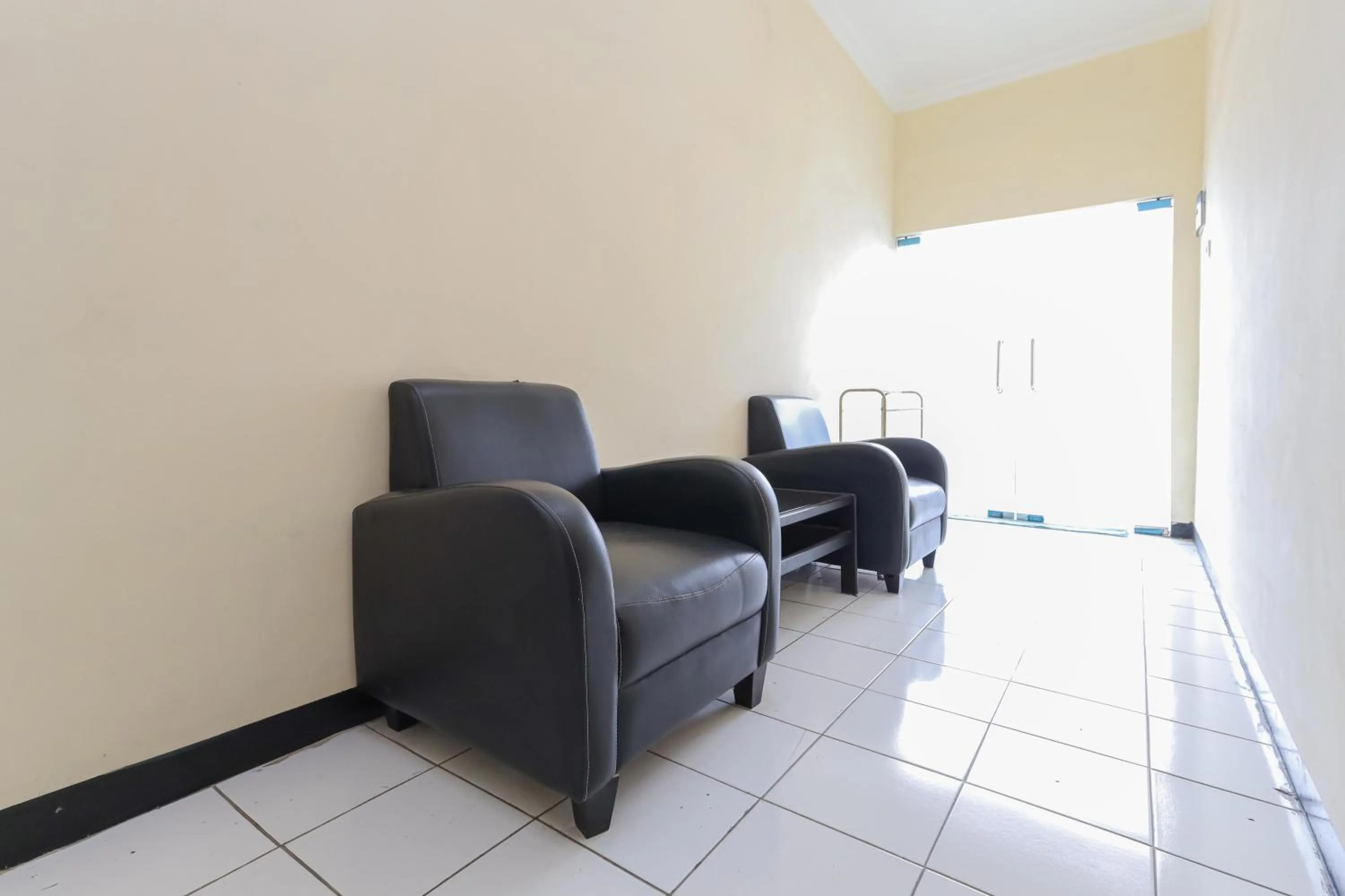 Living room in Urbanview Roemah Tebet by RedDoorz