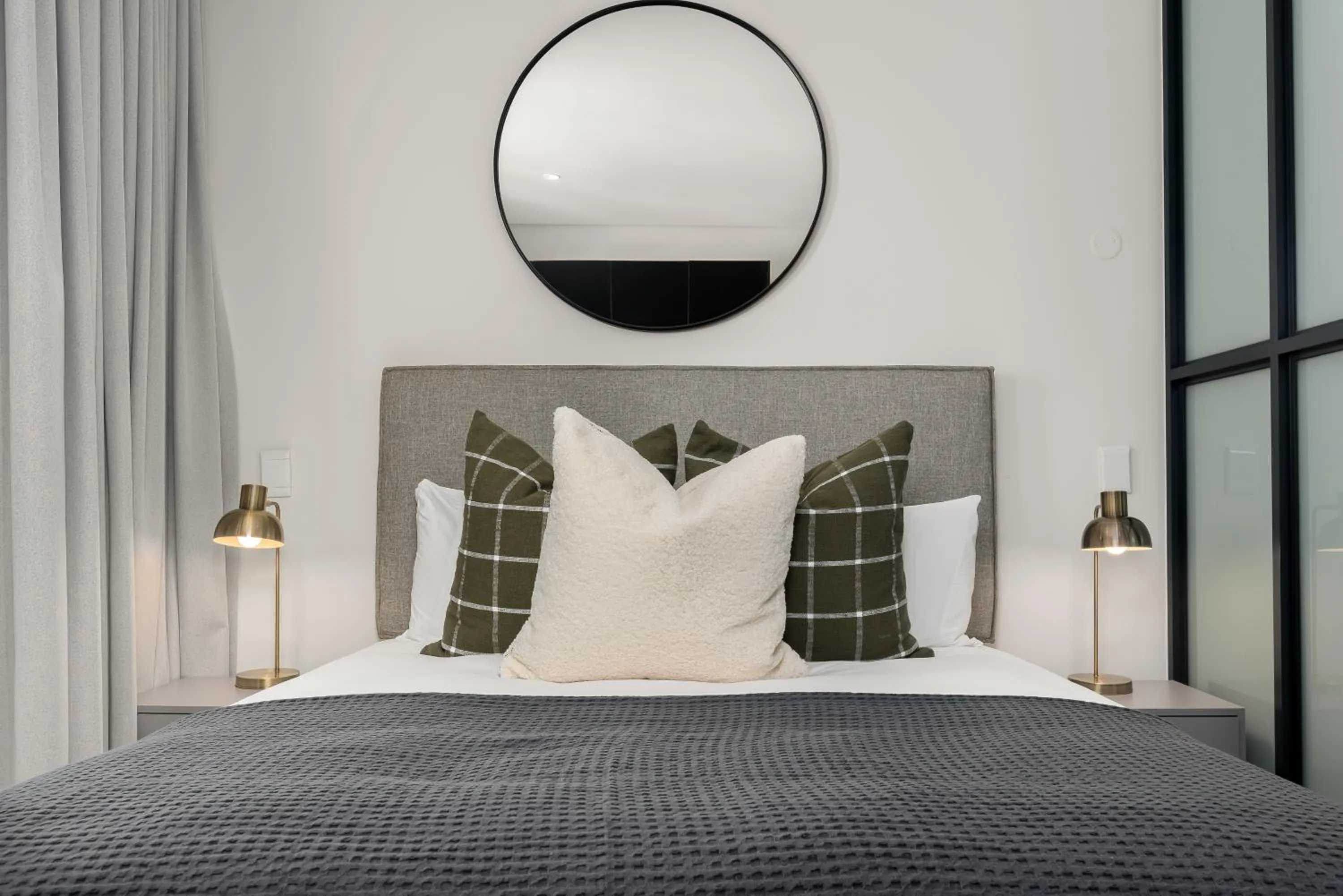 Bed in The Carrington Luxury Apartments