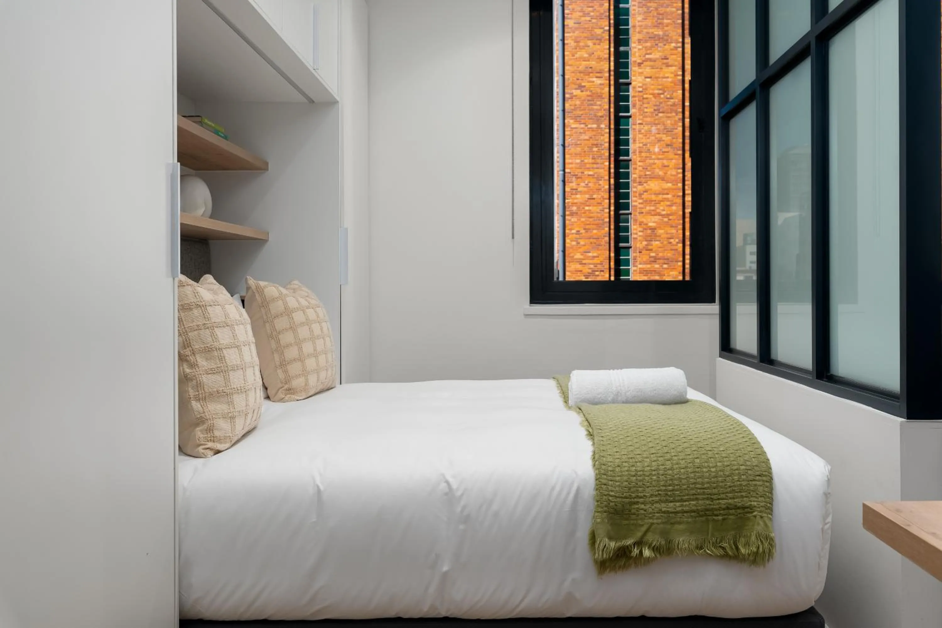Bed in The Carrington Luxury Apartments