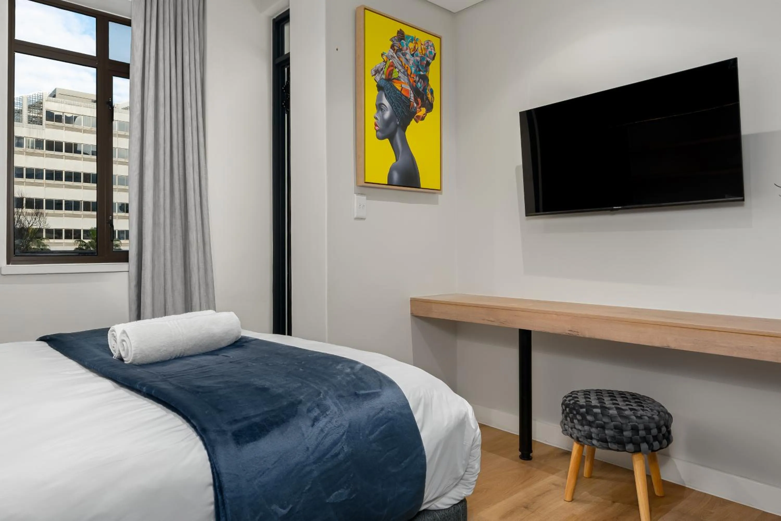 Bed in The Carrington Luxury Apartments
