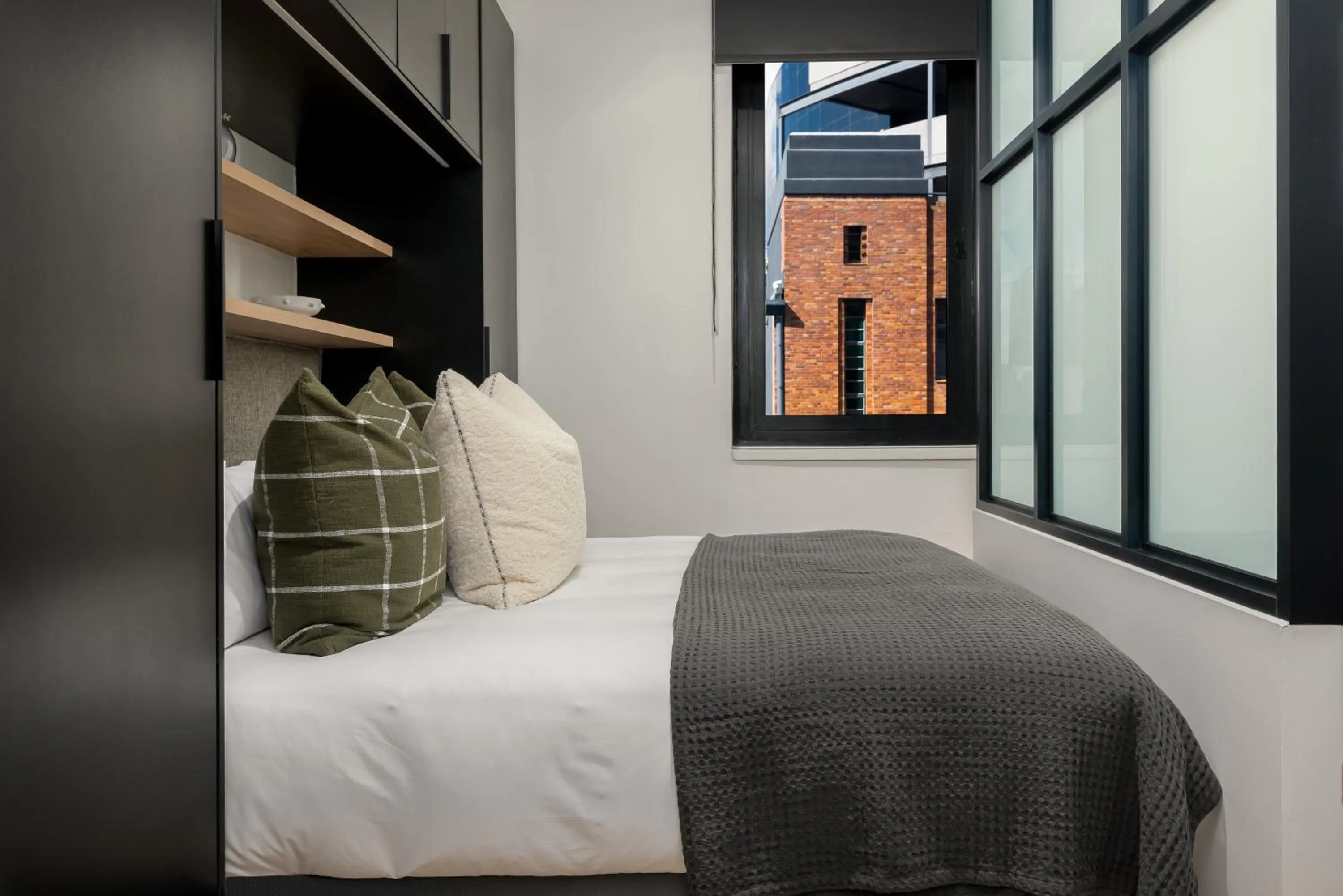 Bed in The Carrington Luxury Apartments