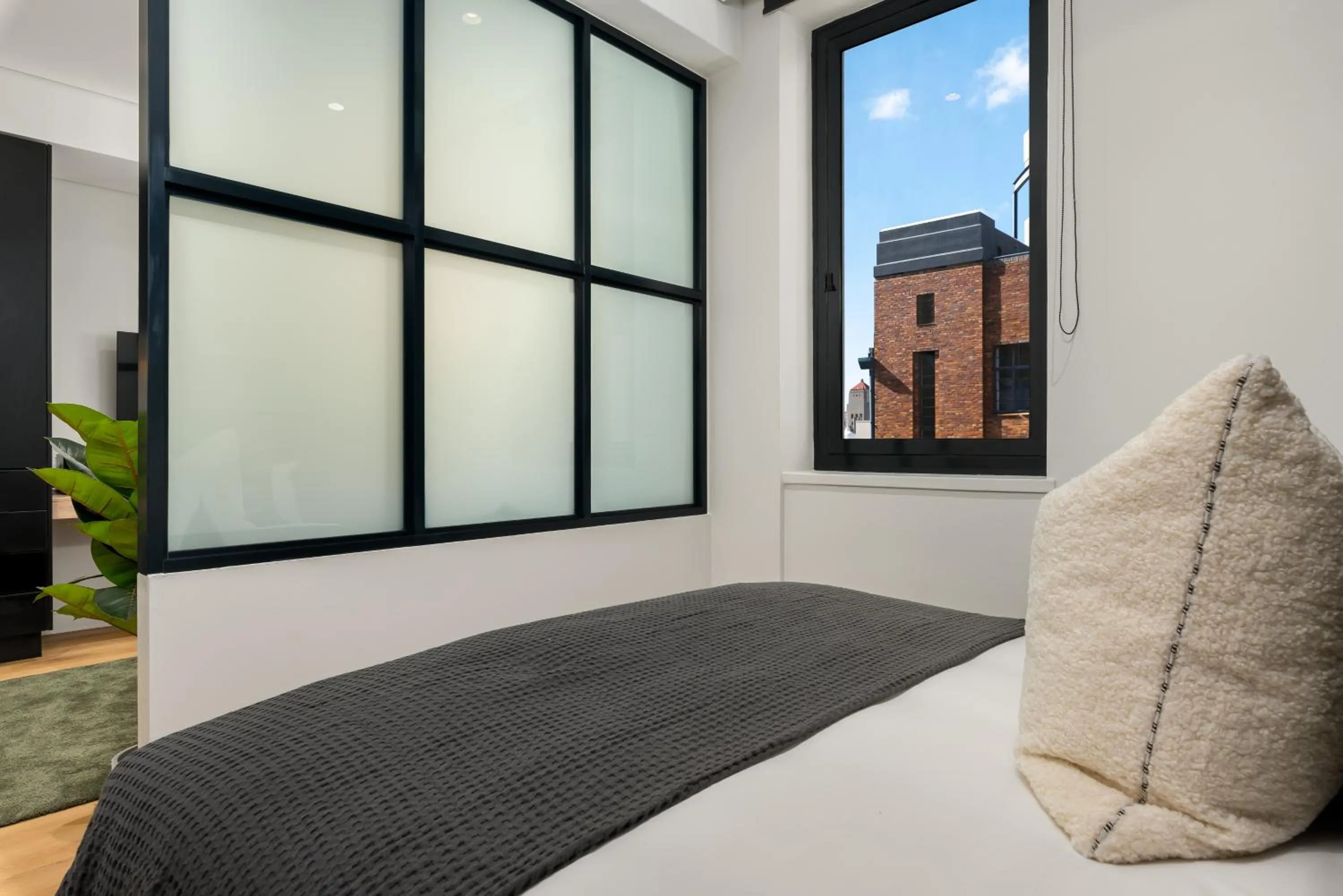 Bed in The Carrington Luxury Apartments