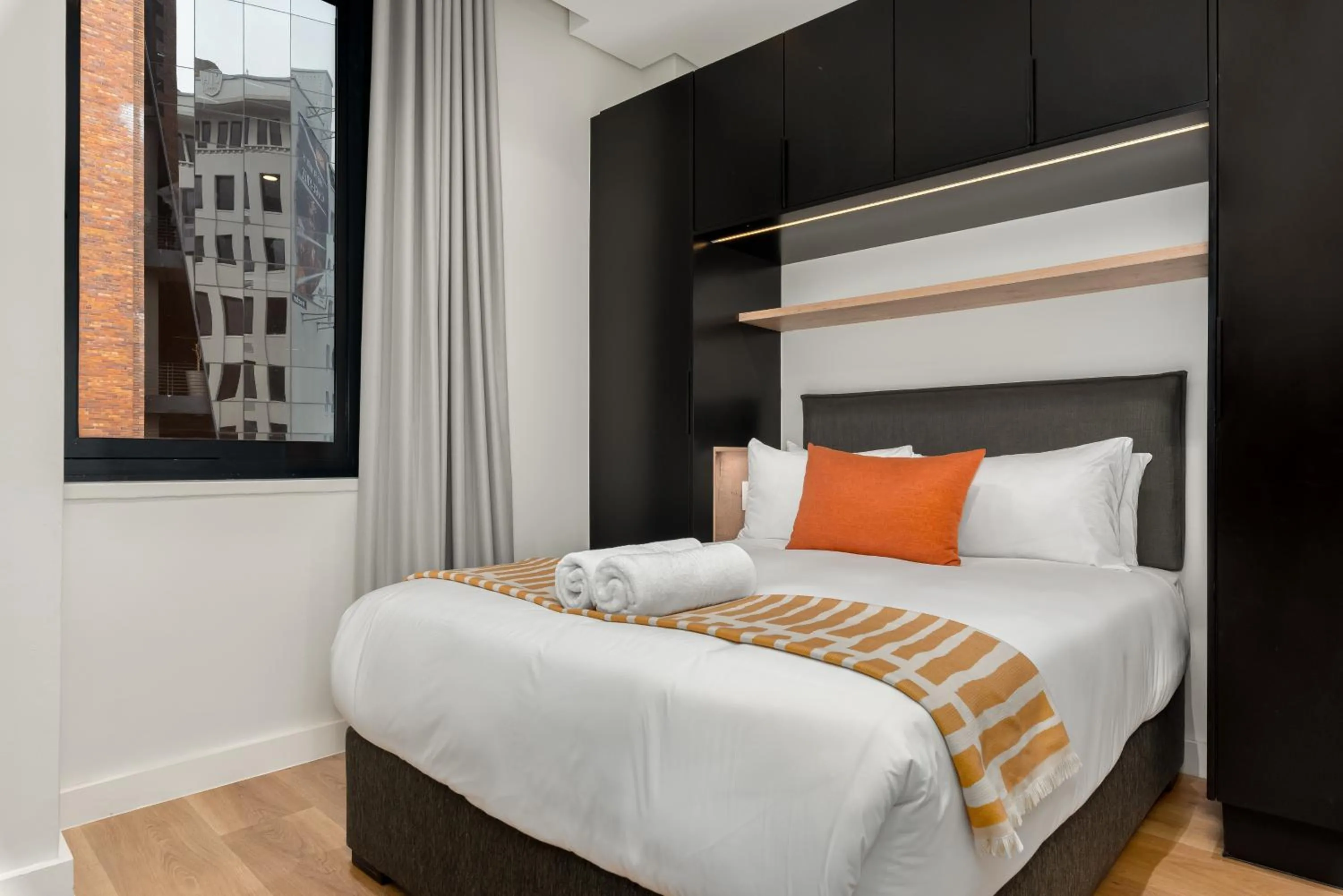 Bed in The Carrington Luxury Apartments