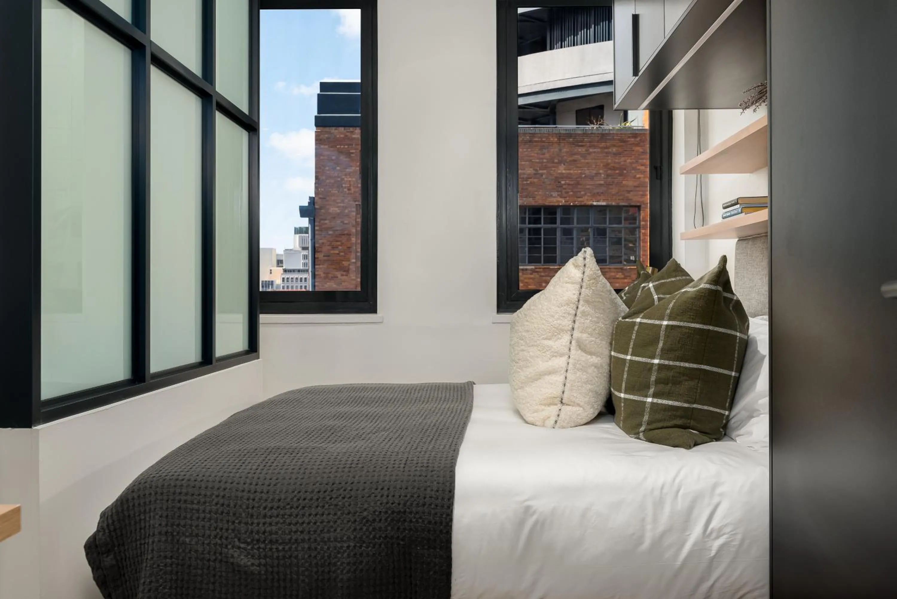 Bed in The Carrington Luxury Apartments