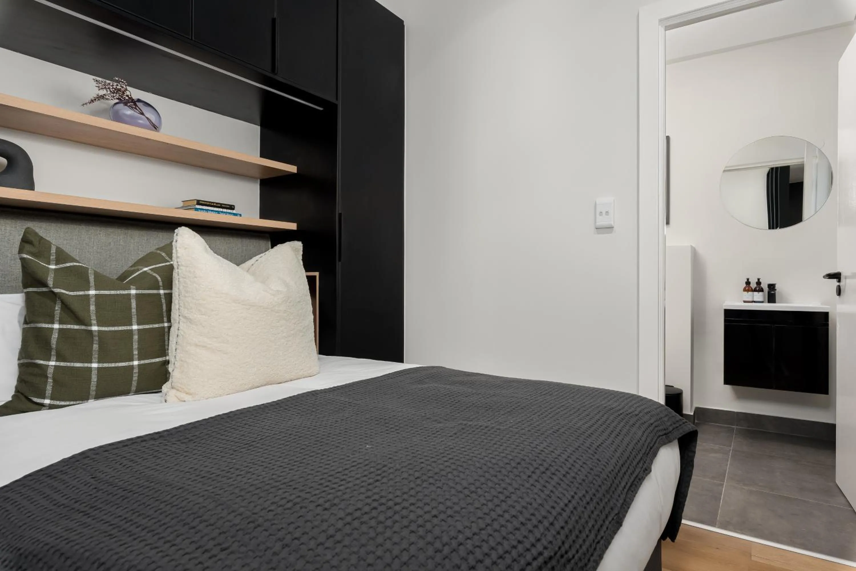 Bed in The Carrington Luxury Apartments