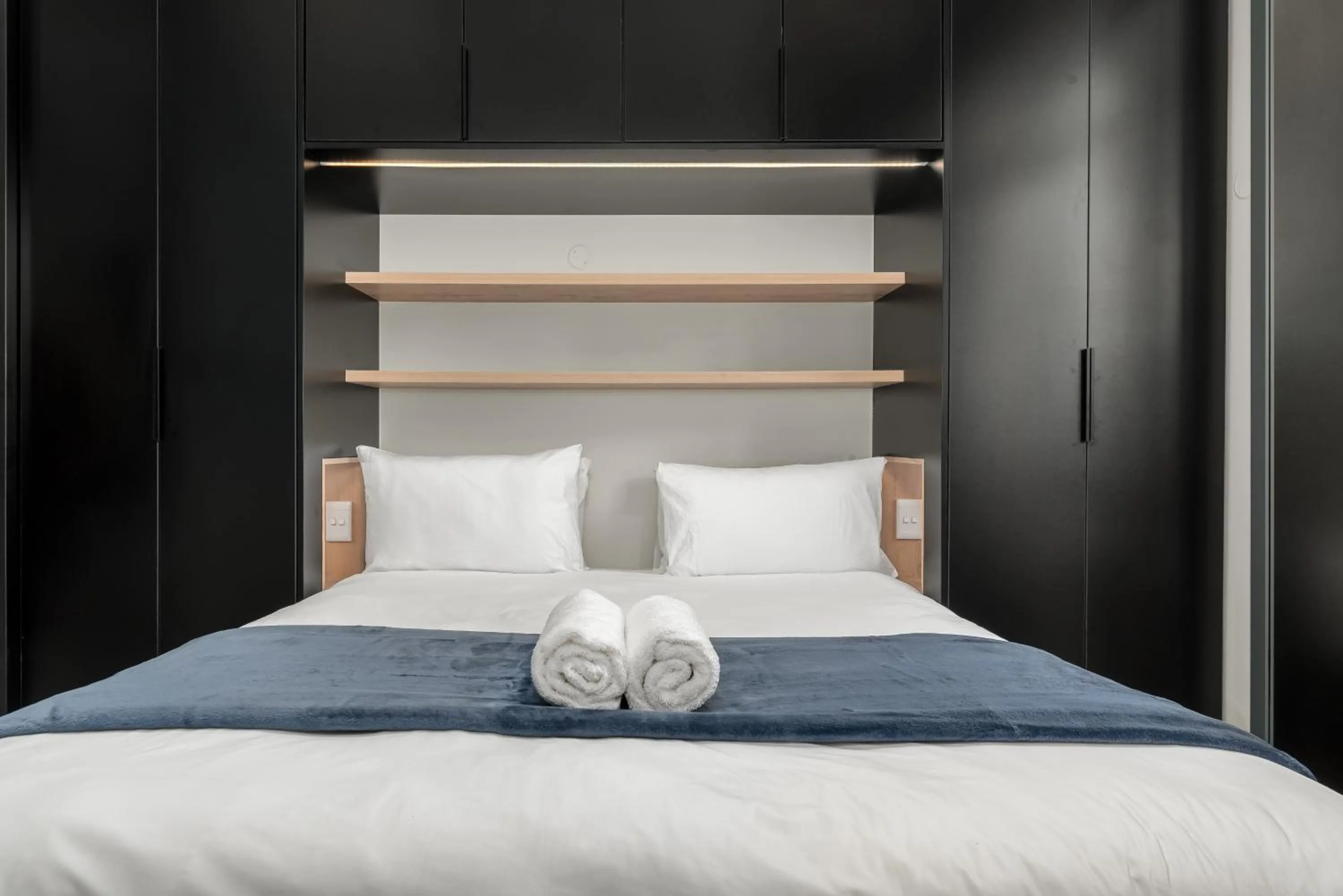 Bed in The Carrington Luxury Apartments