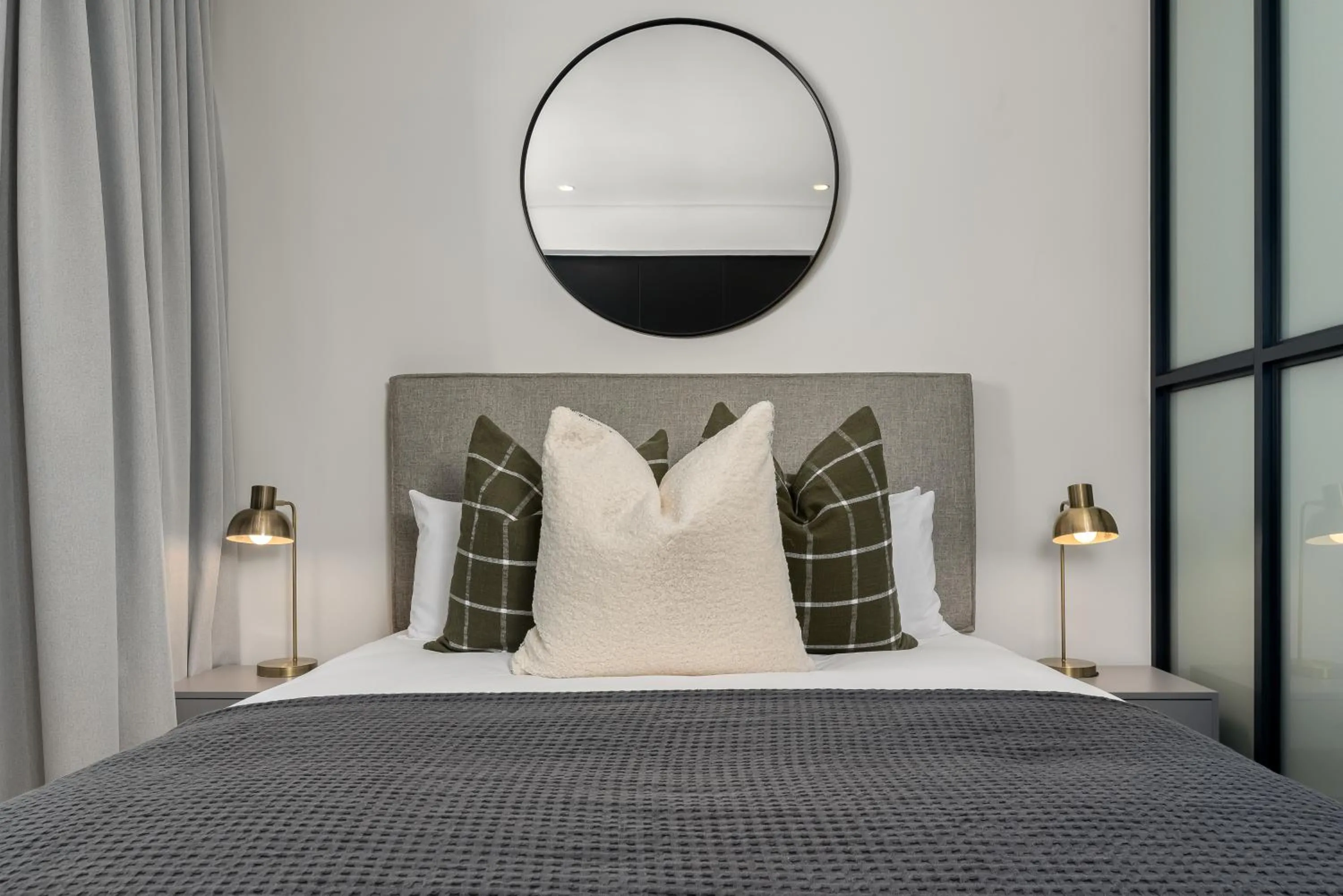 Bed in The Carrington Luxury Apartments