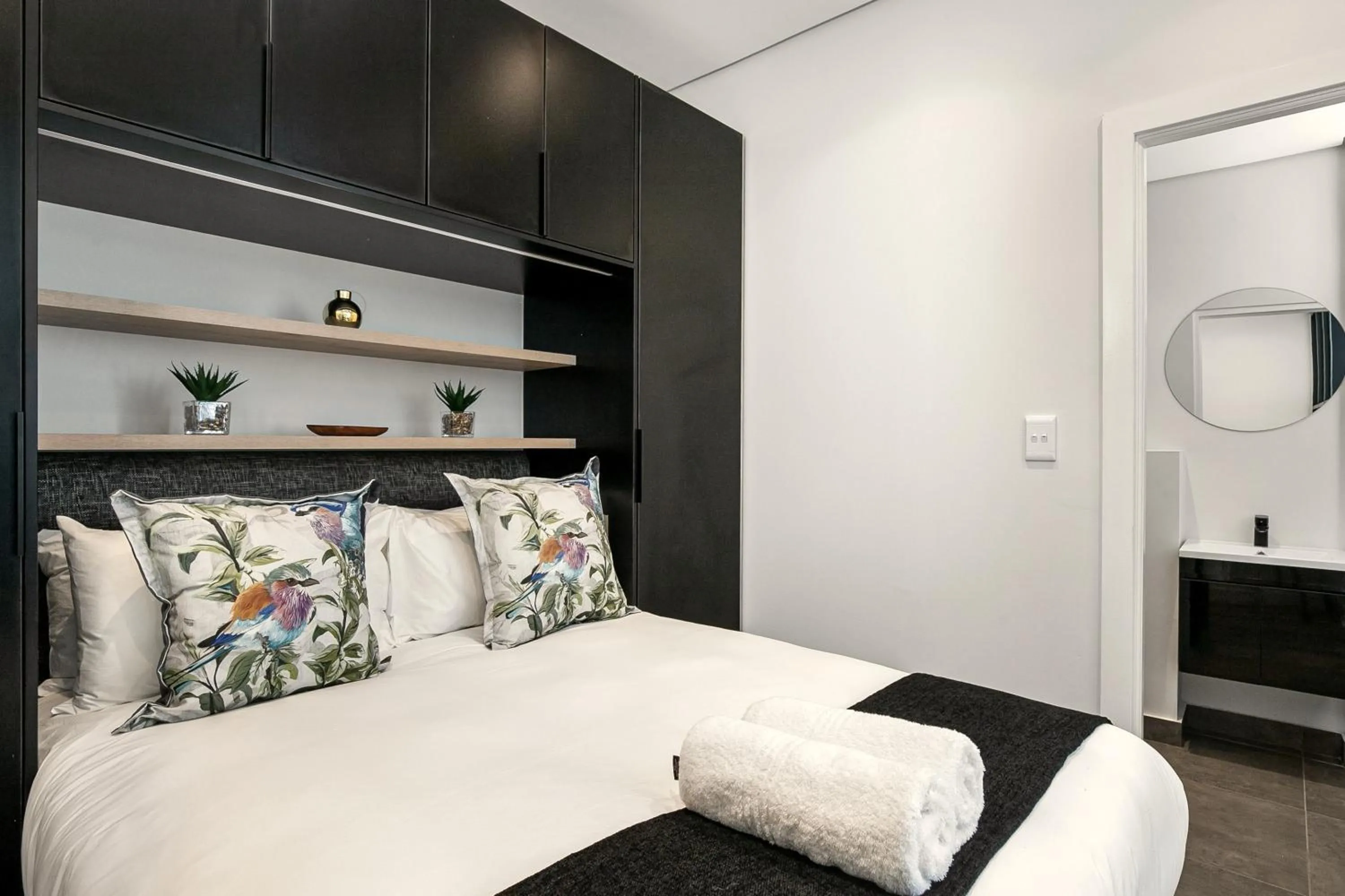 Bed in The Carrington Luxury Apartments