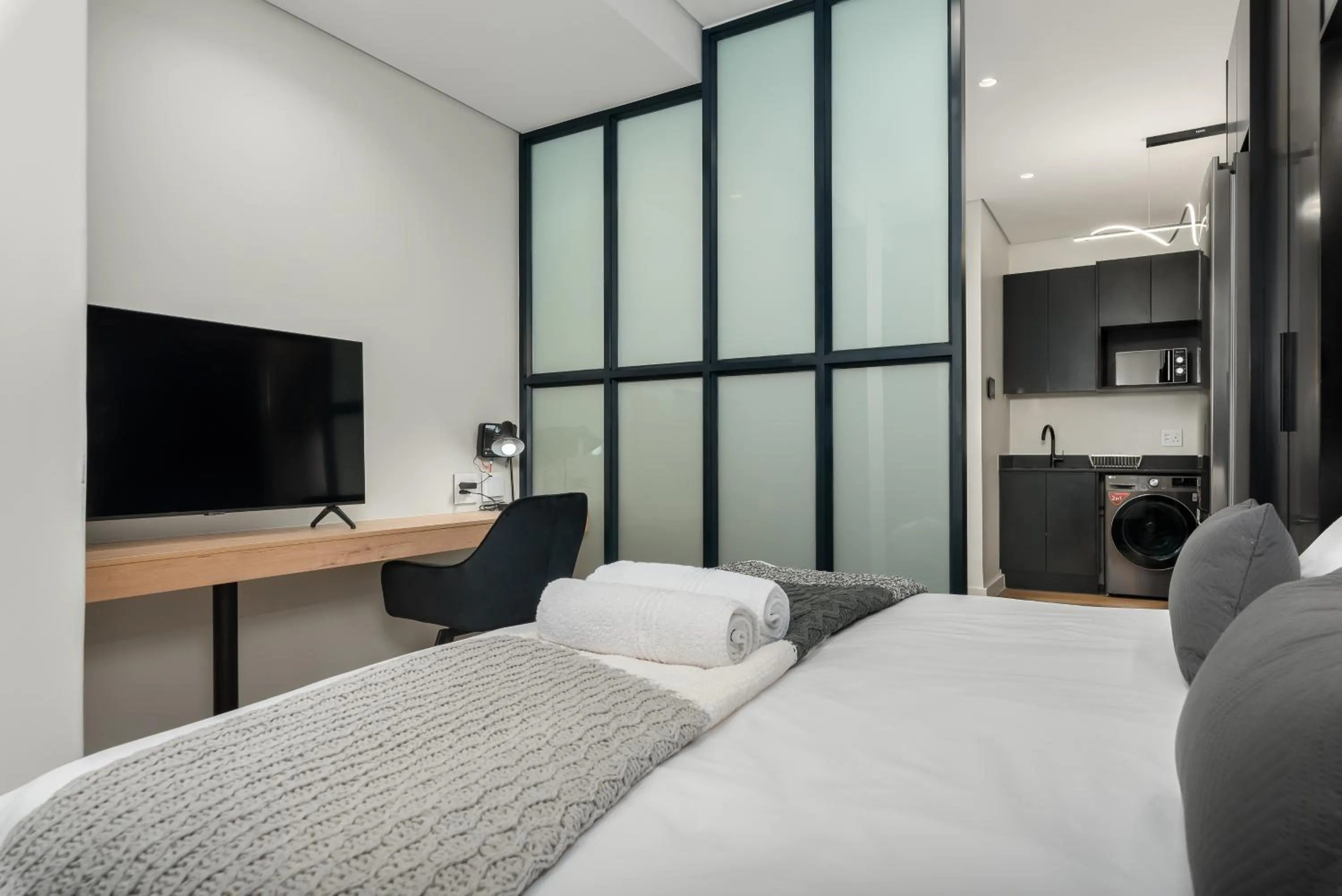 Bed in The Carrington Luxury Apartments
