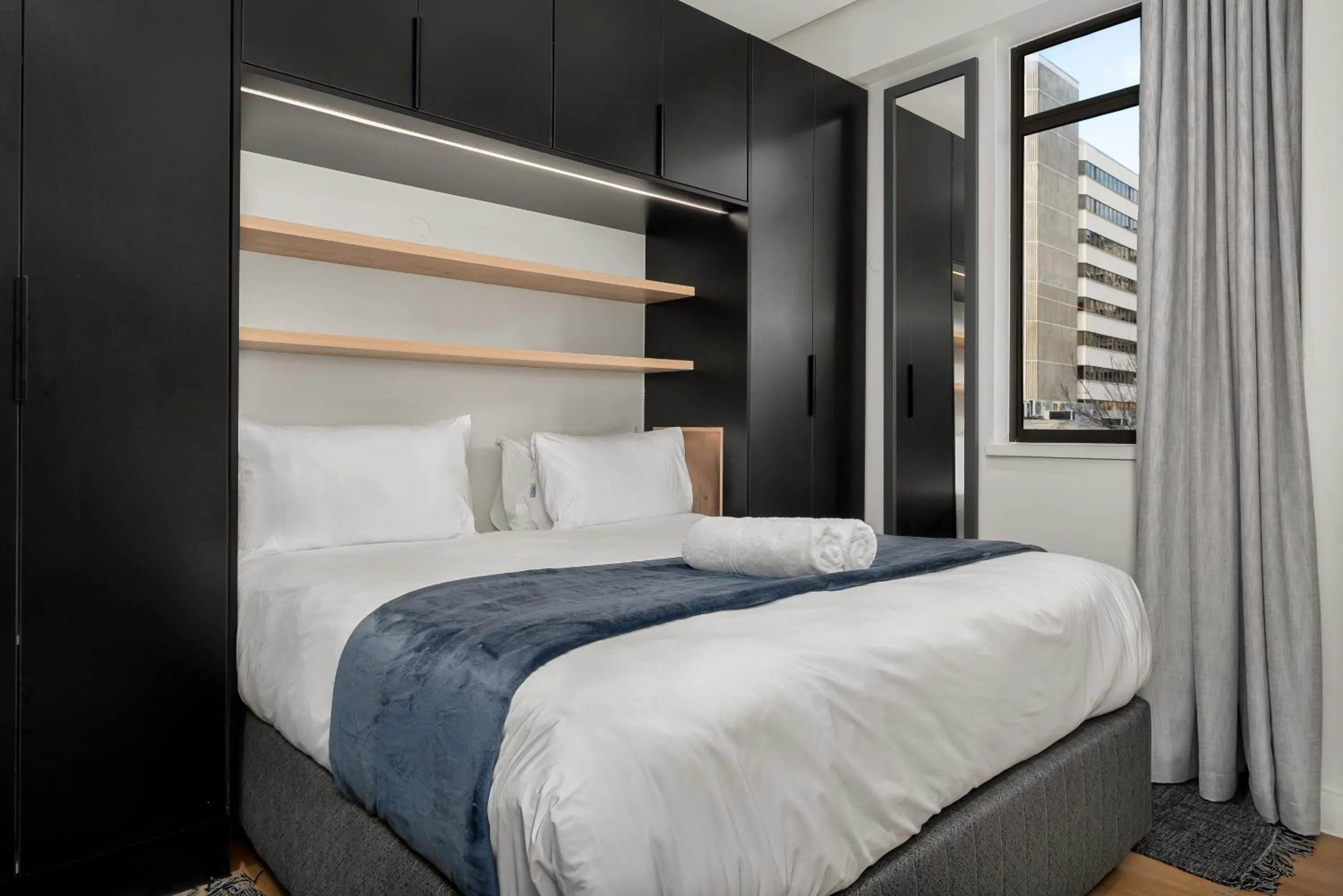 Bed in The Carrington Luxury Apartments