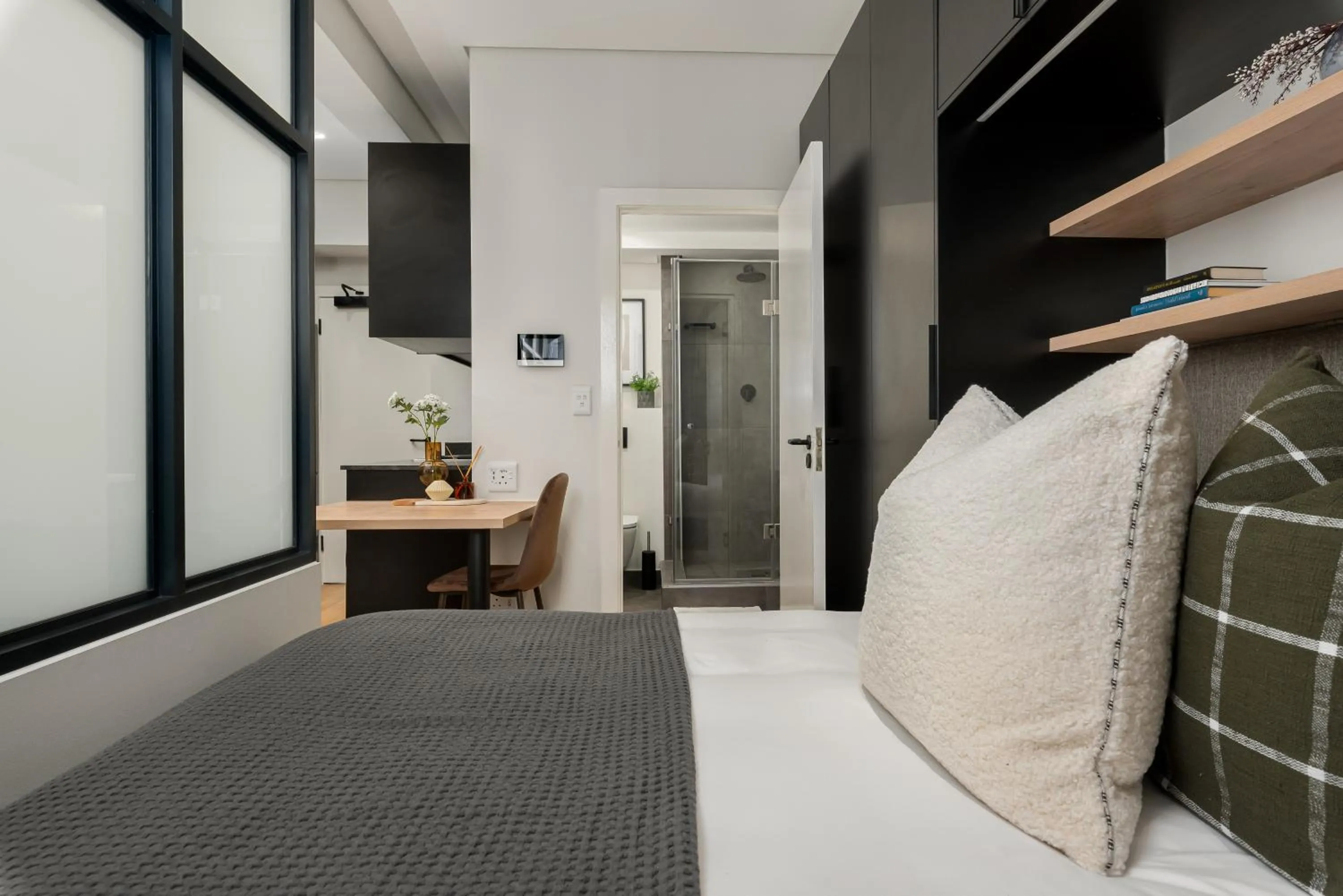 Bed in The Carrington Luxury Apartments
