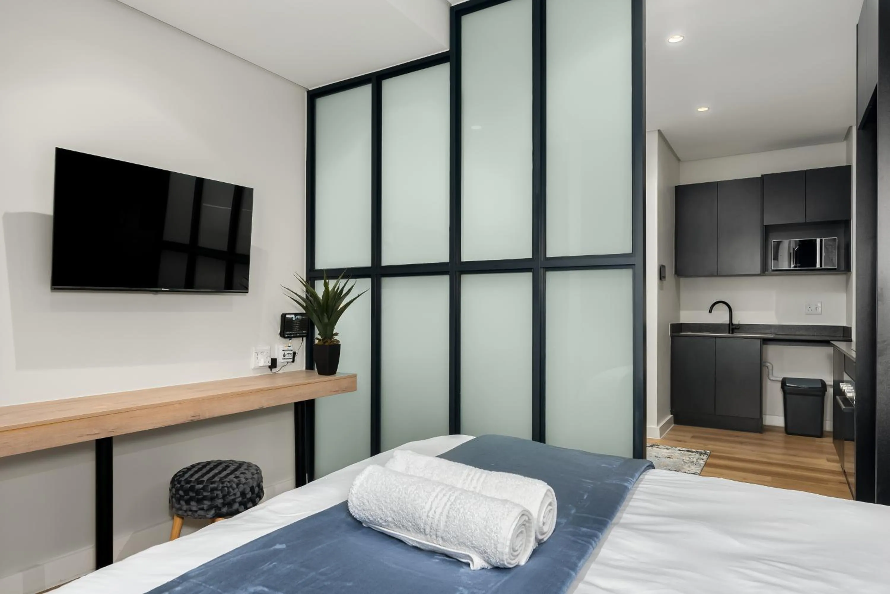 Bed in The Carrington Luxury Apartments