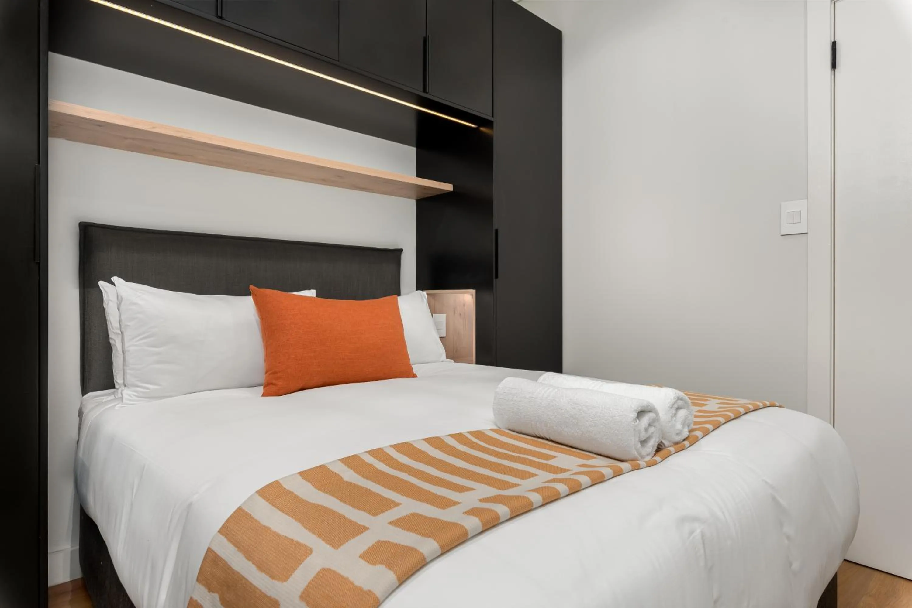 Bed in The Carrington Luxury Apartments