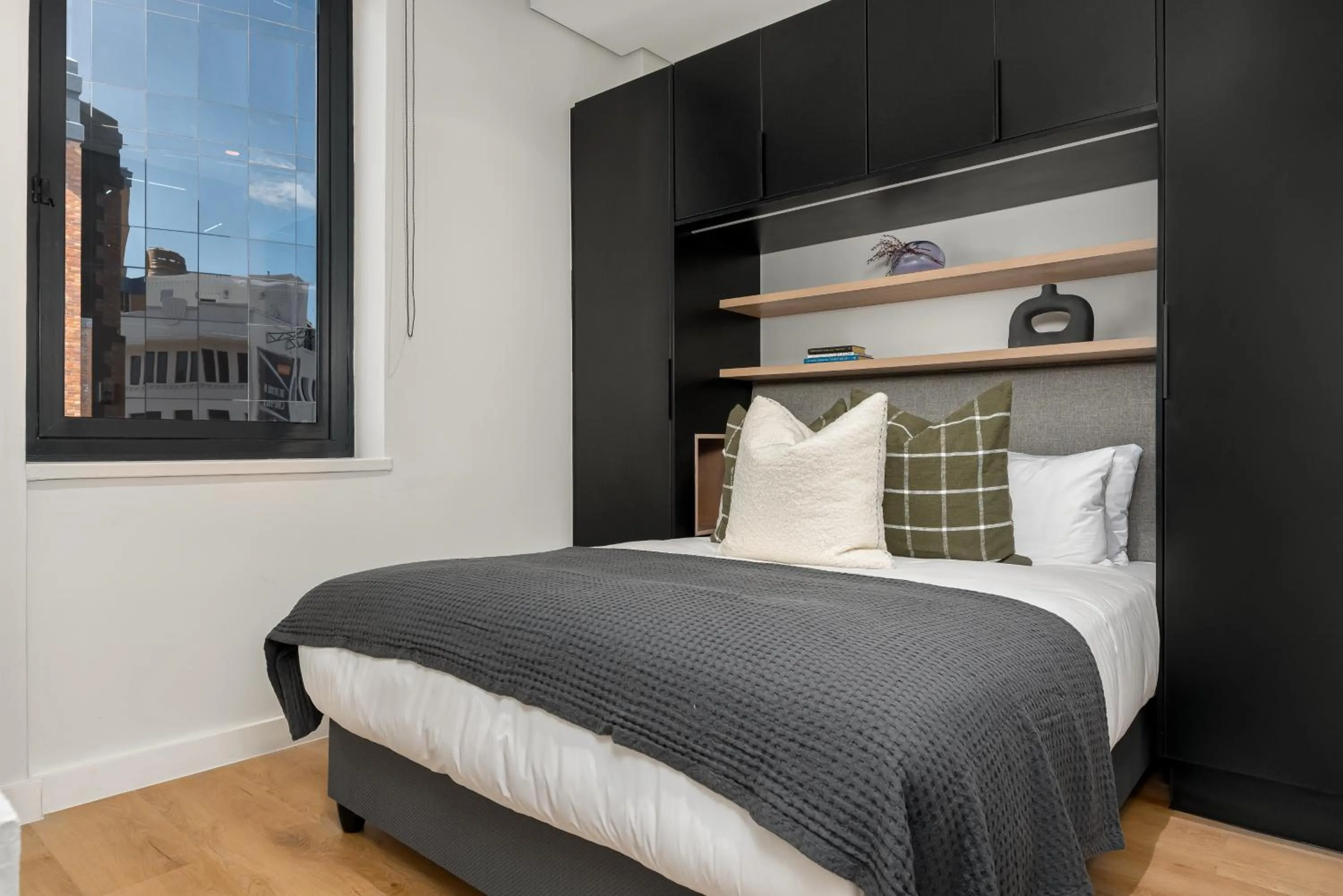 Bed in The Carrington Luxury Apartments
