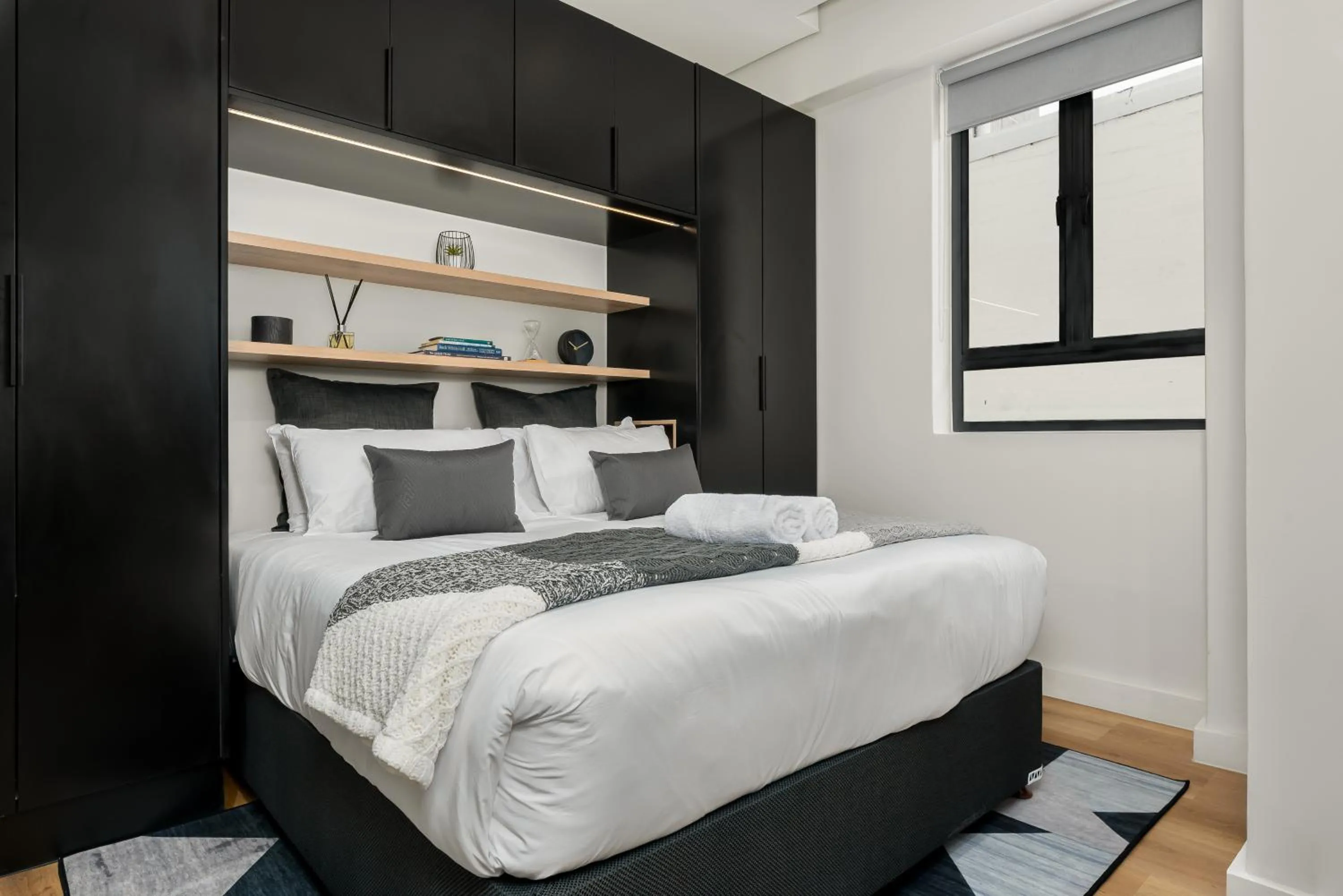 Bed in The Carrington Luxury Apartments