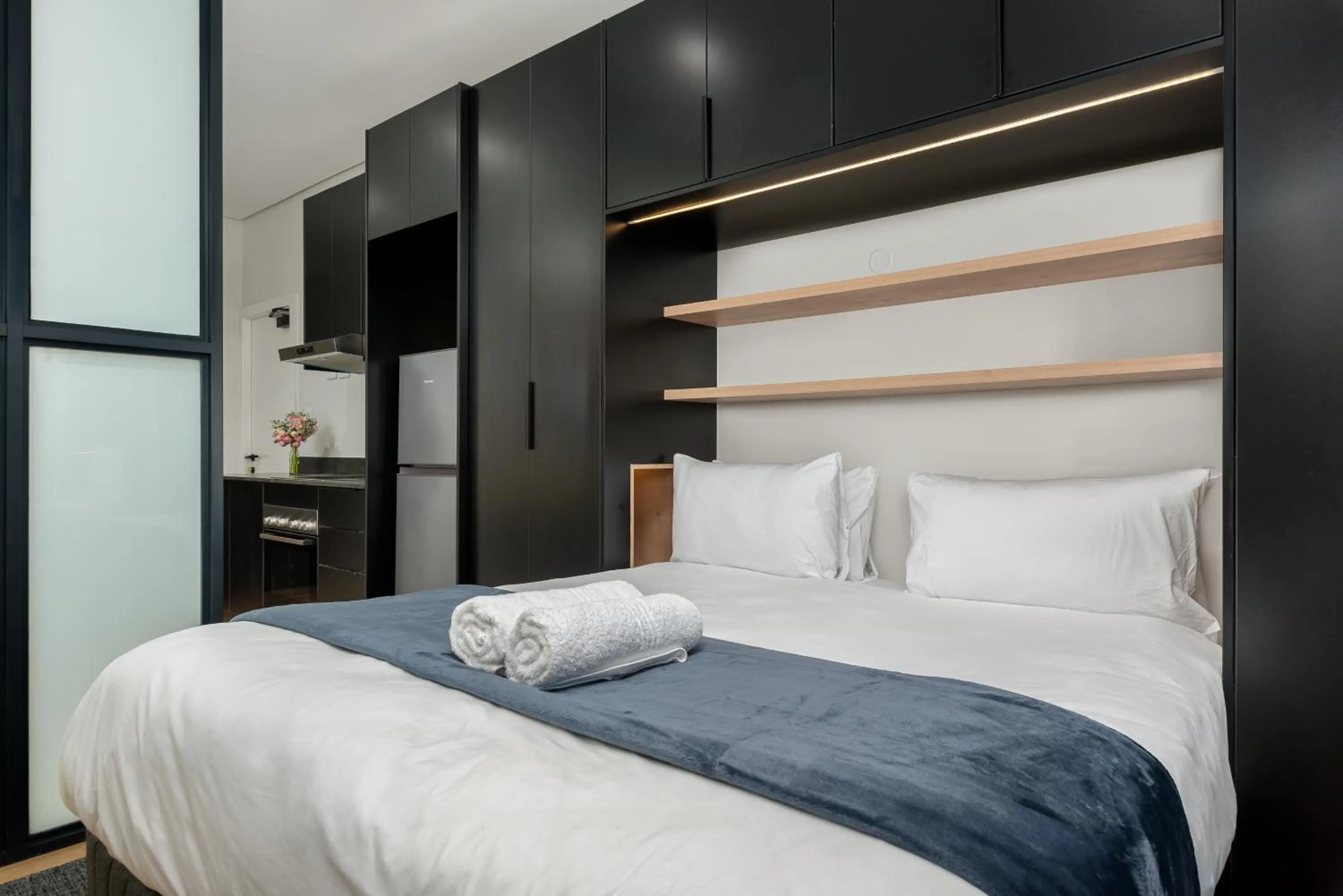 Bed in The Carrington Luxury Apartments