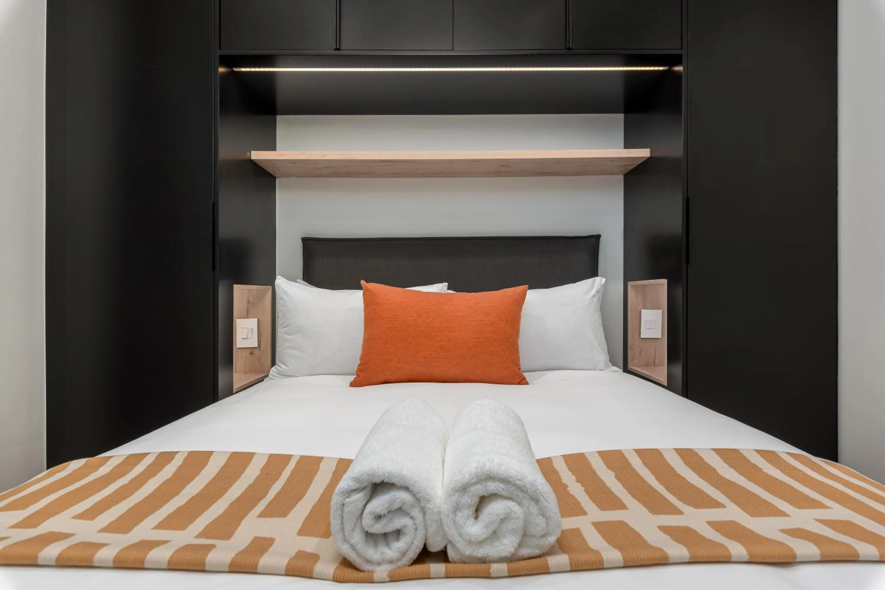 Bed in The Carrington Luxury Apartments