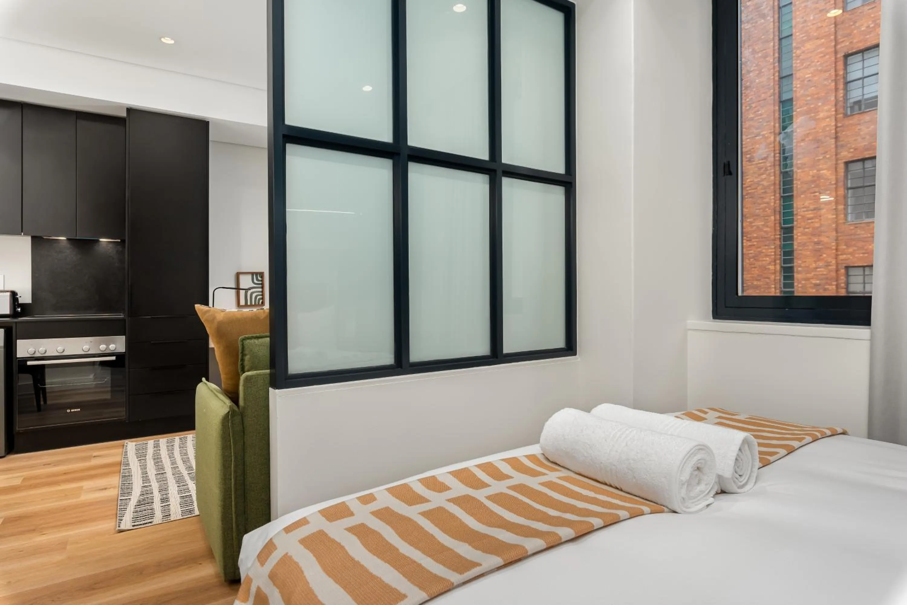 Bed in The Carrington Luxury Apartments