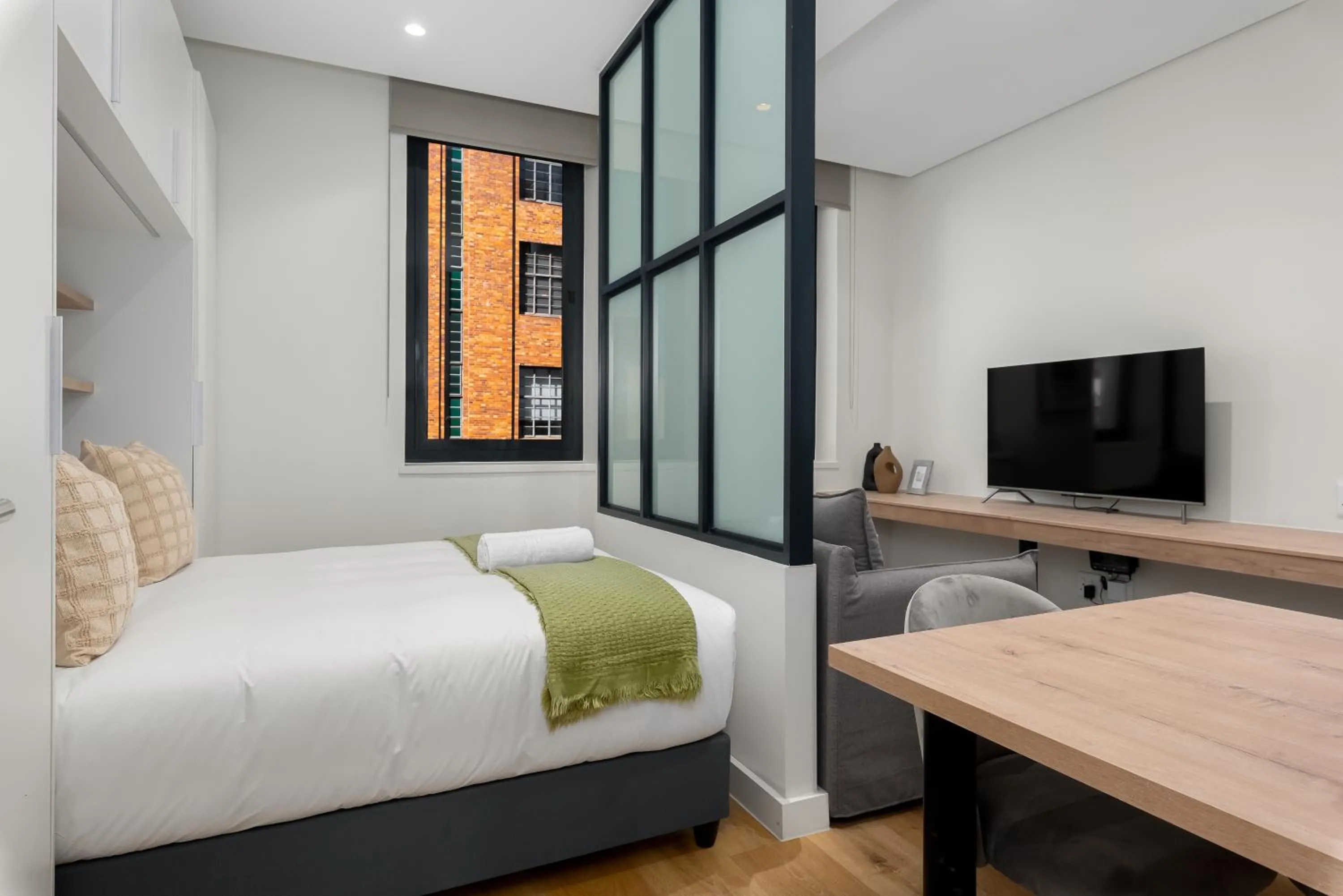 Bed in The Carrington Luxury Apartments