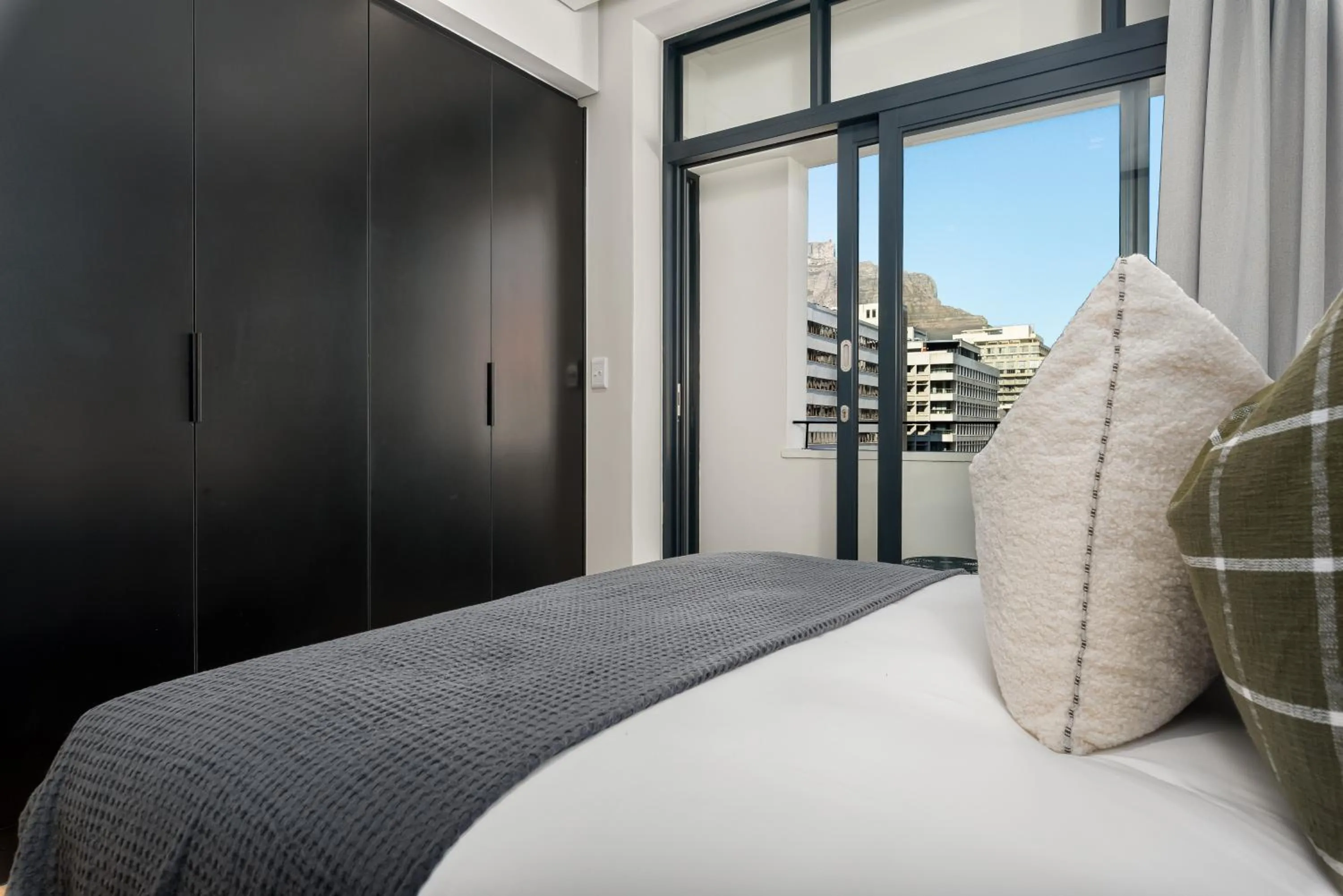 Bed in The Carrington Luxury Apartments