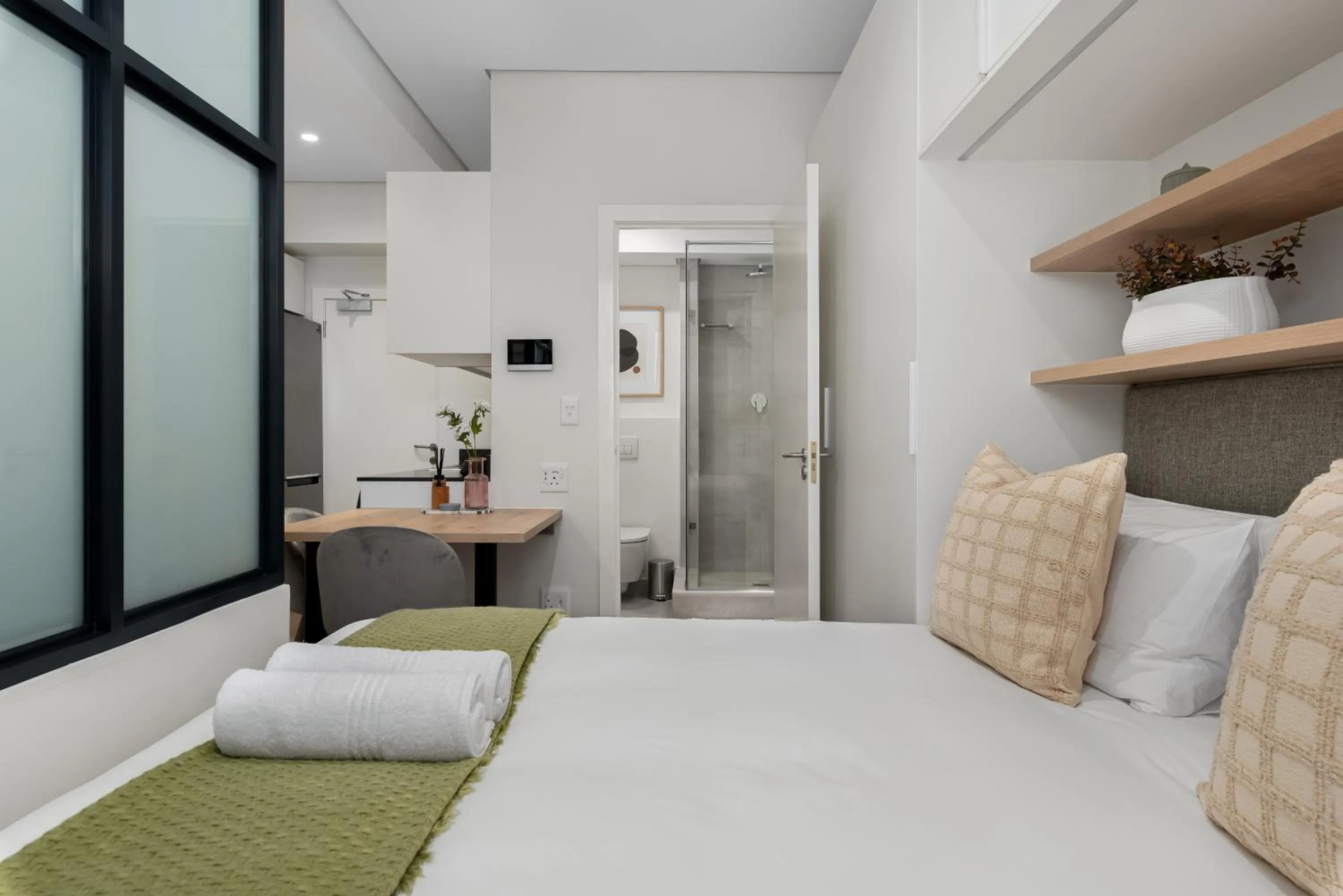 Bed in The Carrington Luxury Apartments