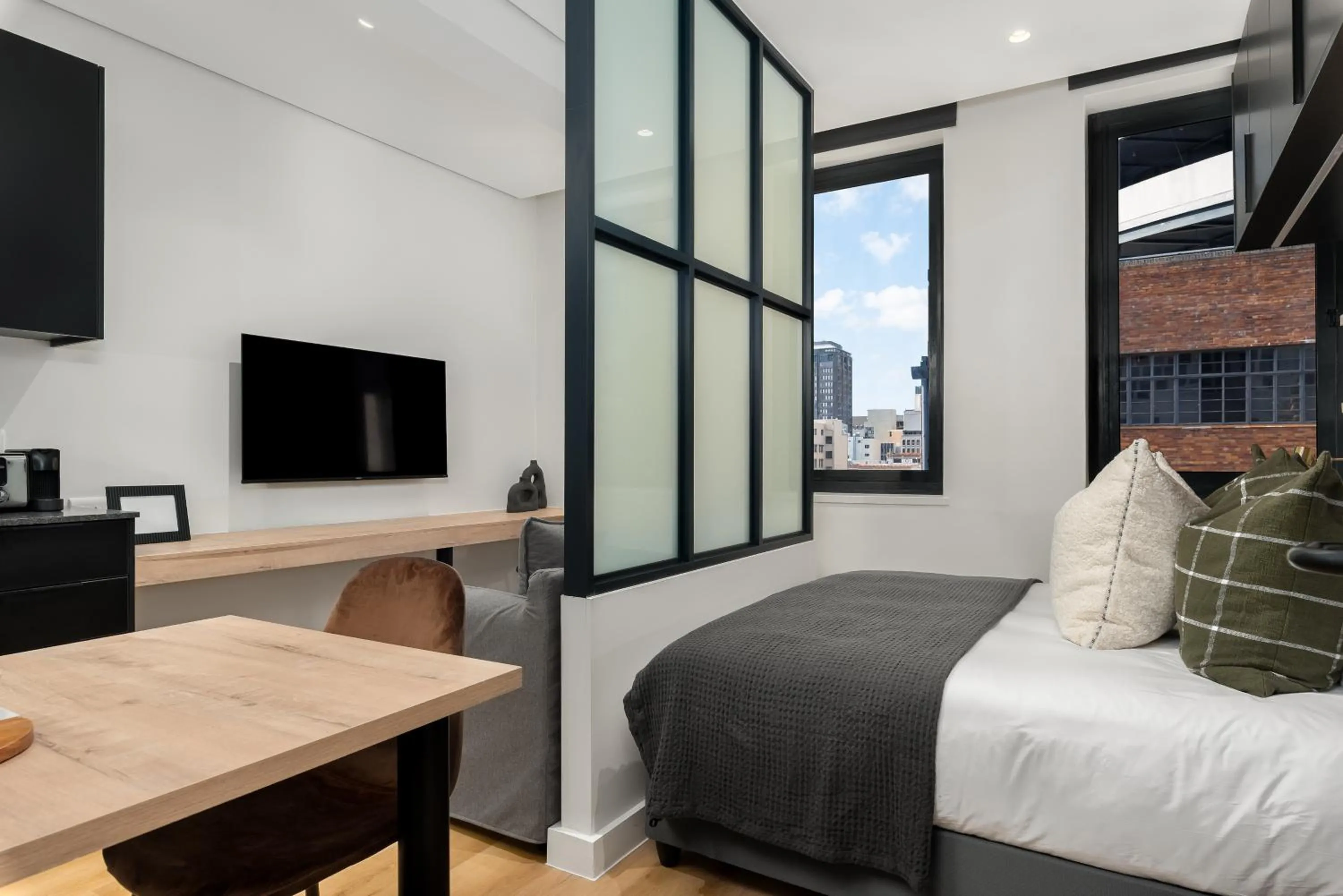 Bed in The Carrington Luxury Apartments