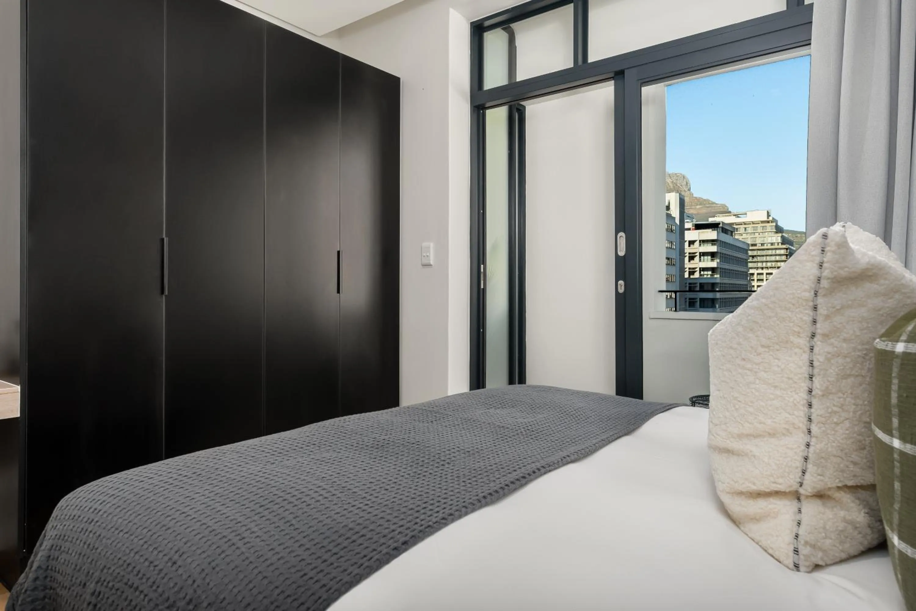 Bed in The Carrington Luxury Apartments