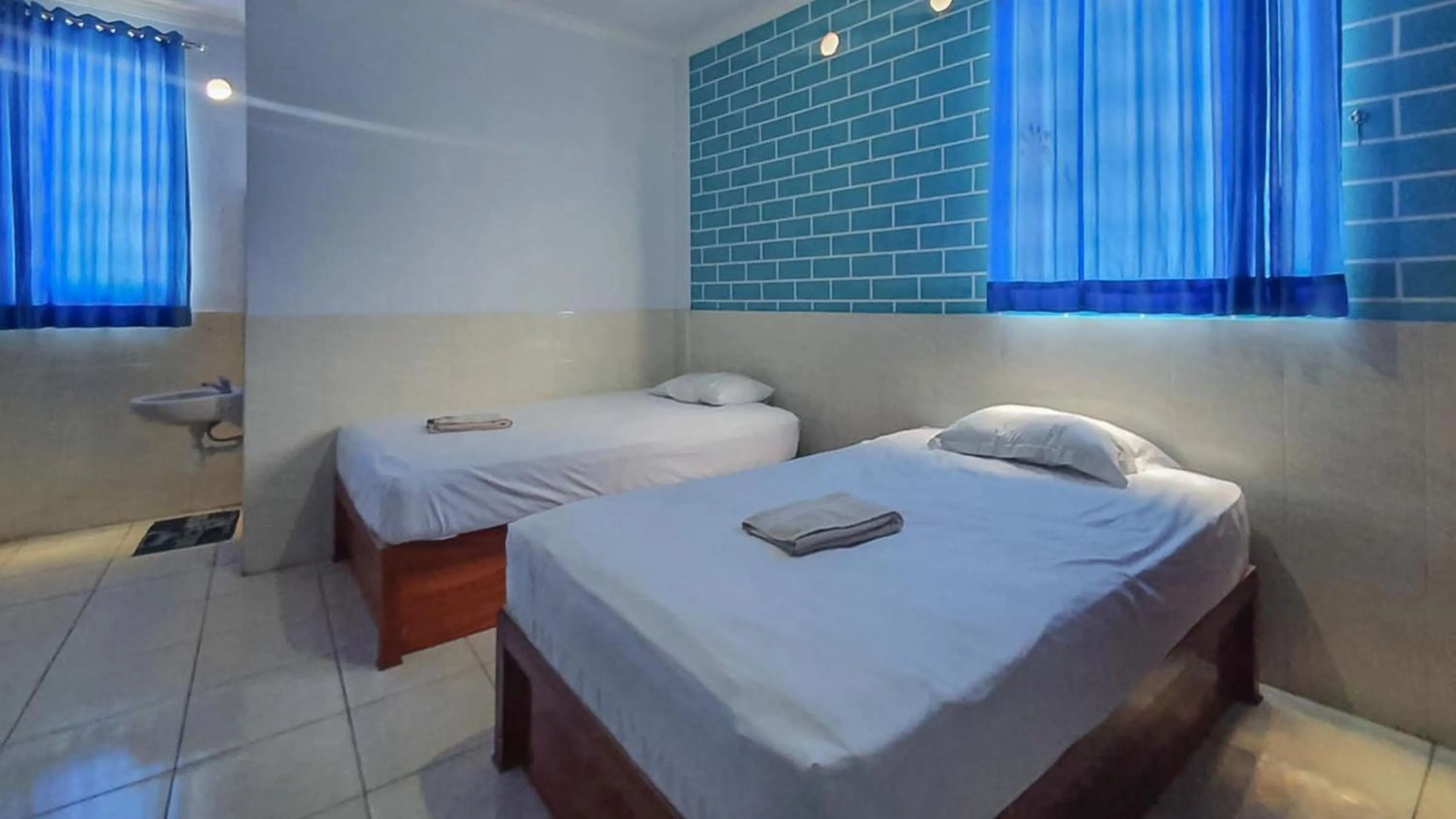 Bedroom, Bed in Reddoorz @ Homestay Gayatri