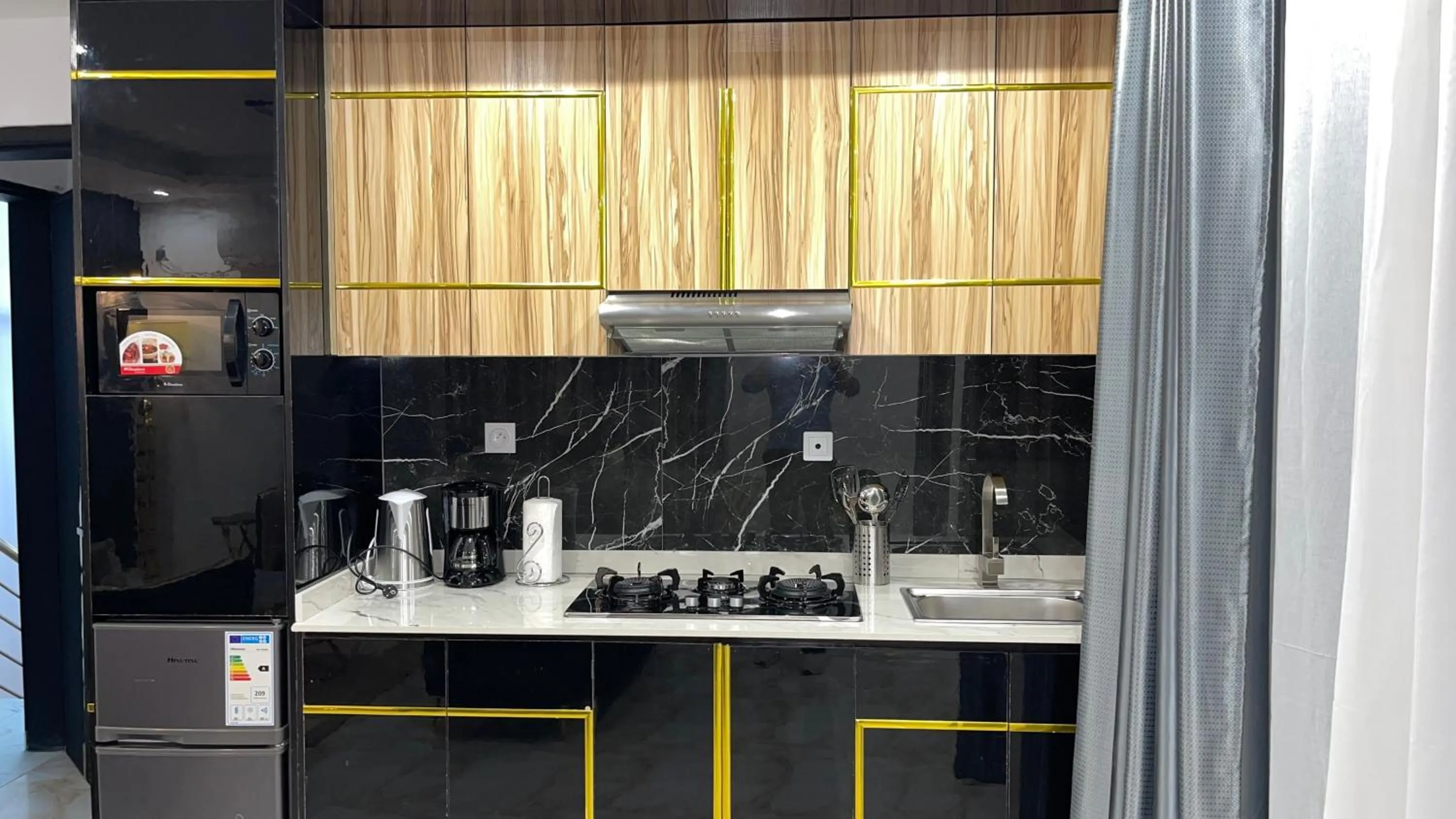 Kitchen or kitchenette in Suna' a Home Bonapriso