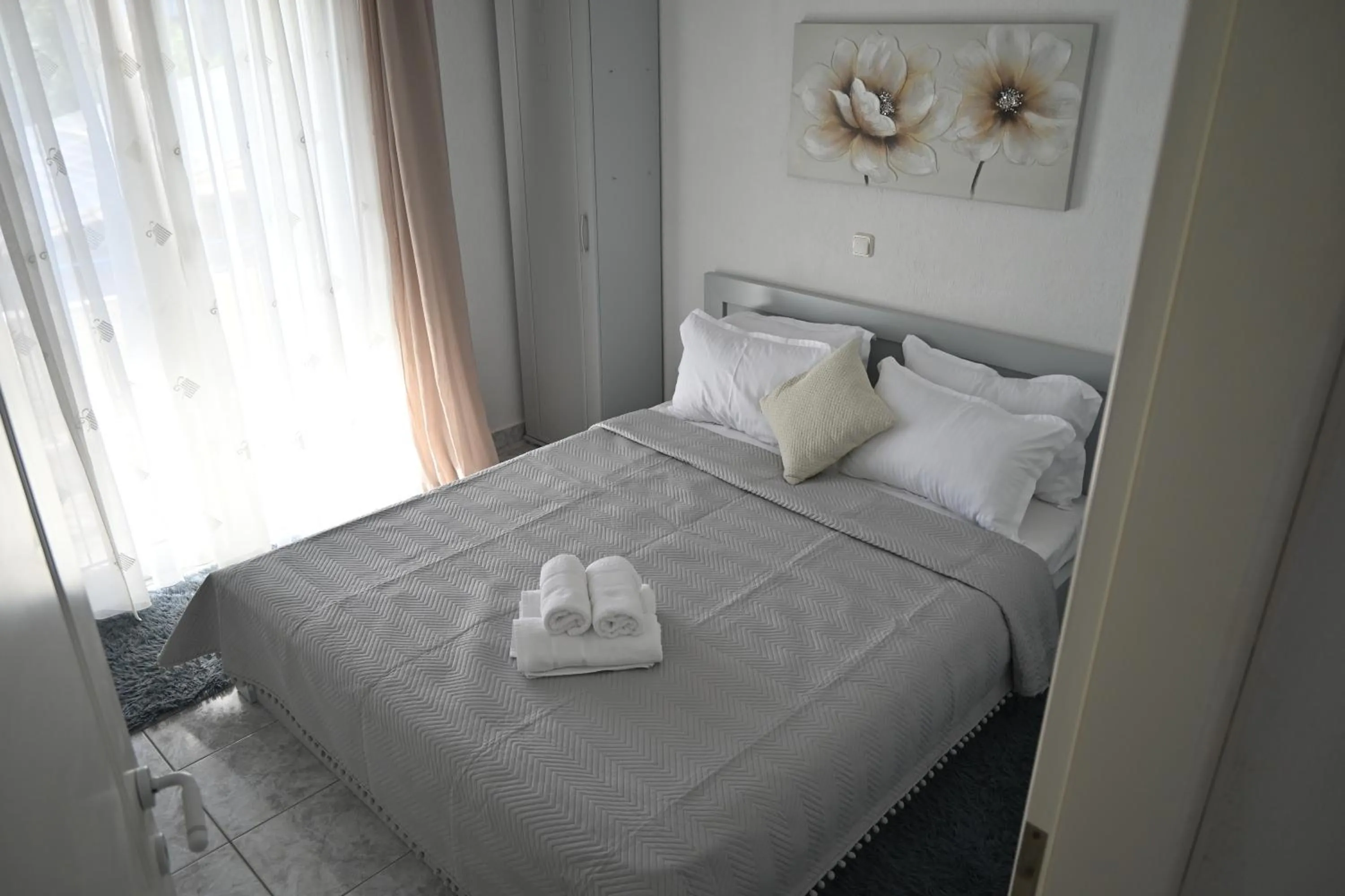 Bed in Doukas Aparthotel