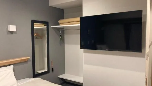 Bed in Jisco Hotel Obama Onsen