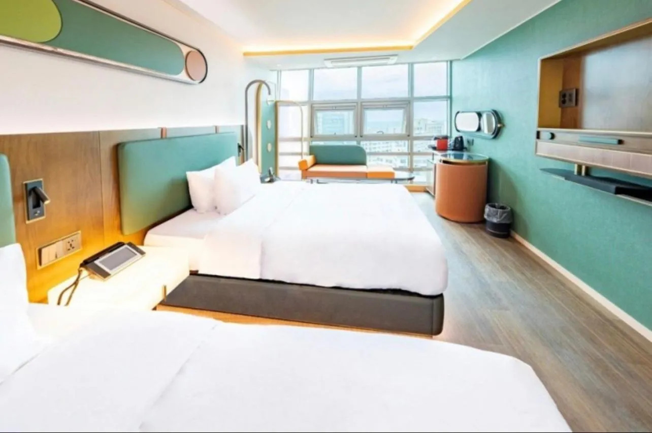 Bed in L&L Central Hotel