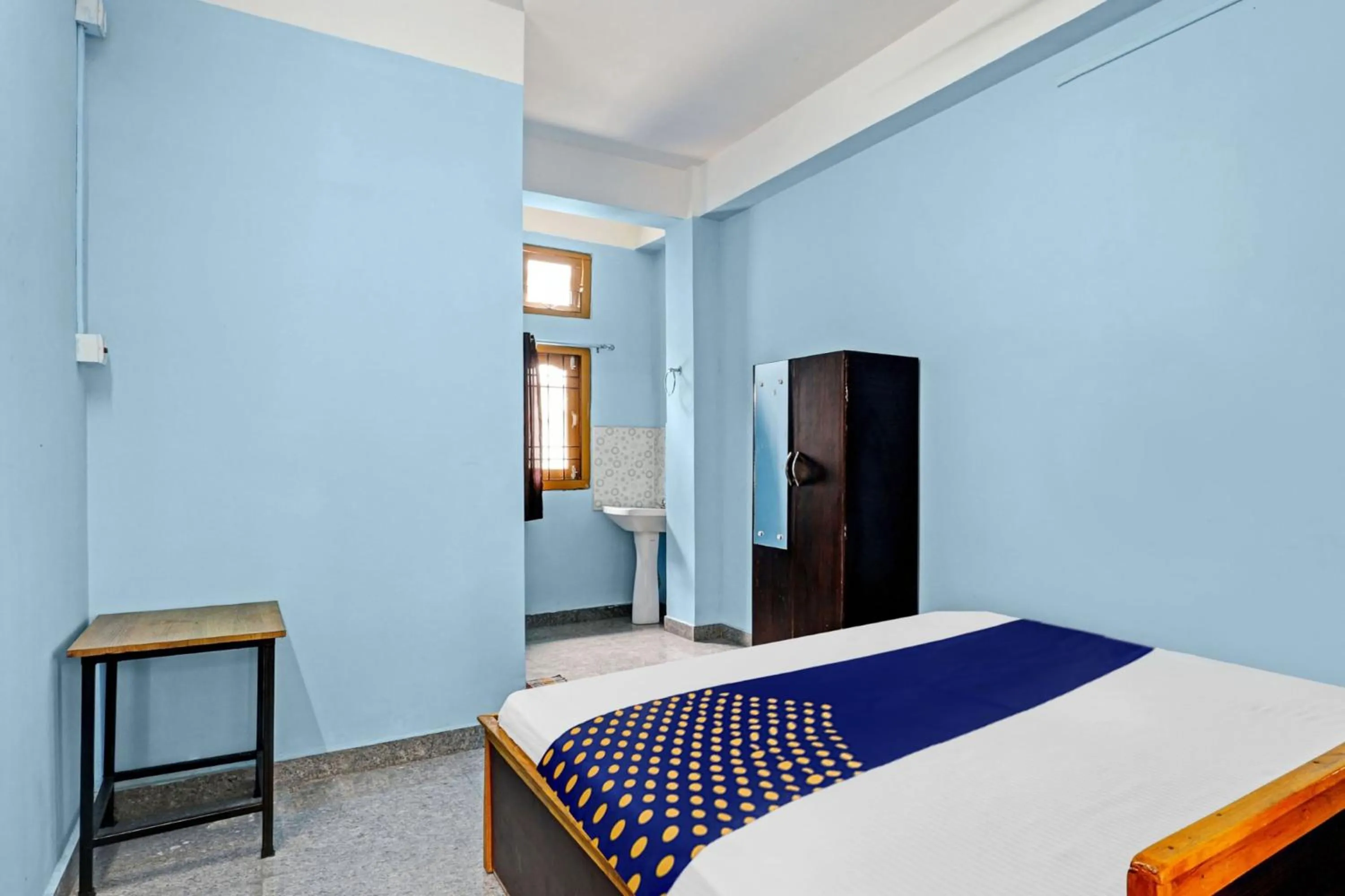 Bedroom in Hotel O Garam Masala Residency