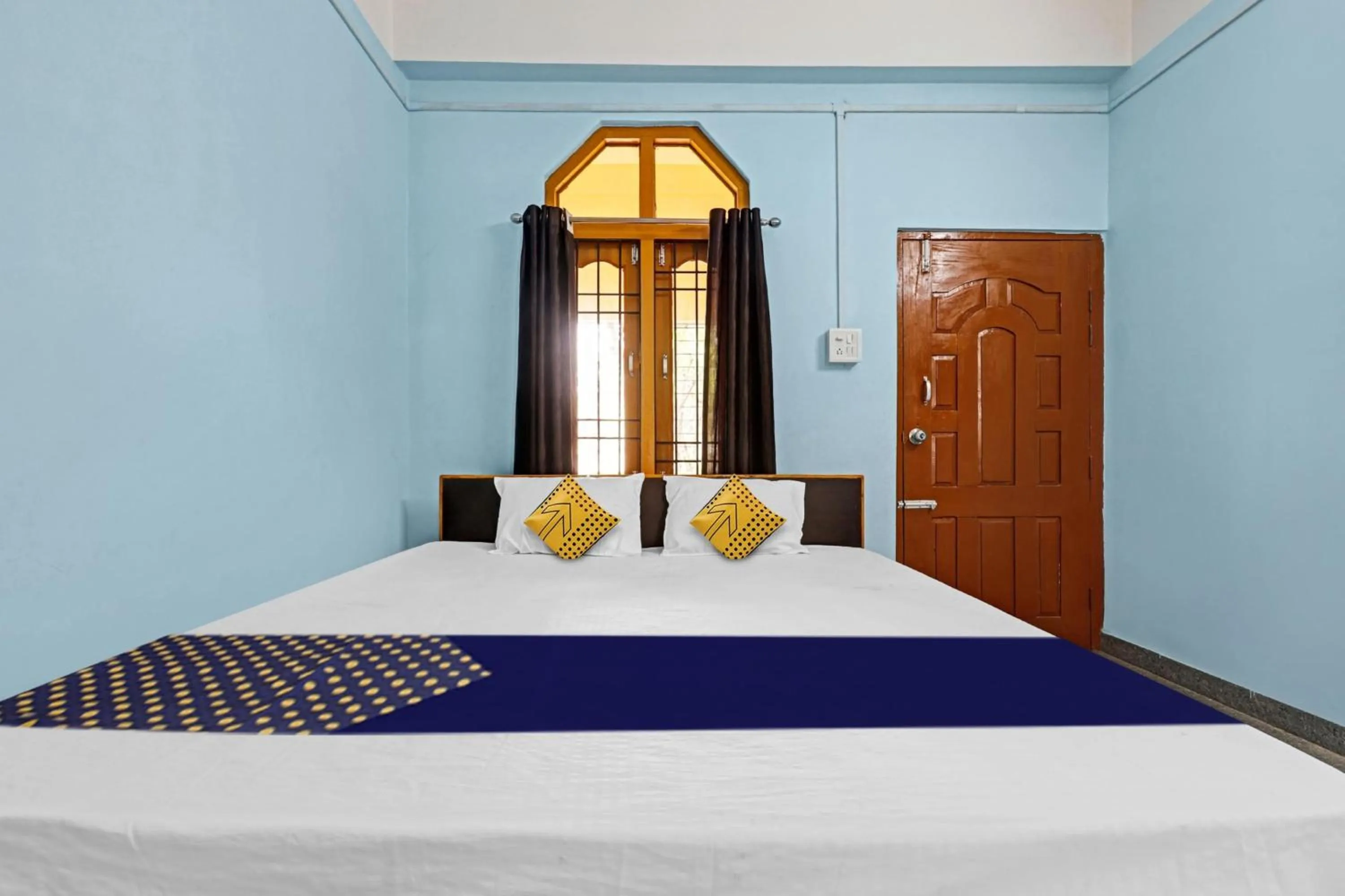 Bedroom in Hotel O Garam Masala Residency