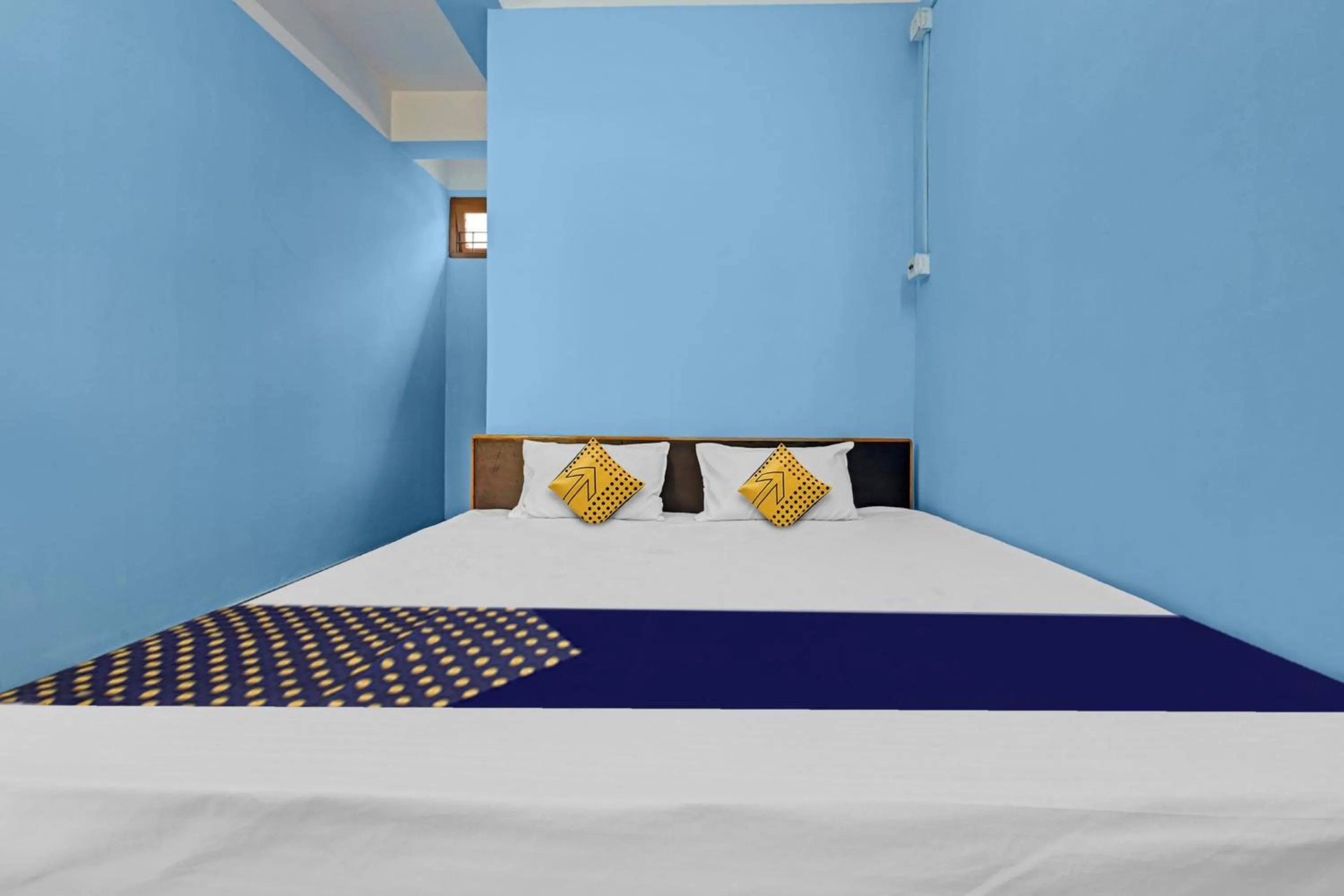 Bedroom in Hotel O Garam Masala Residency
