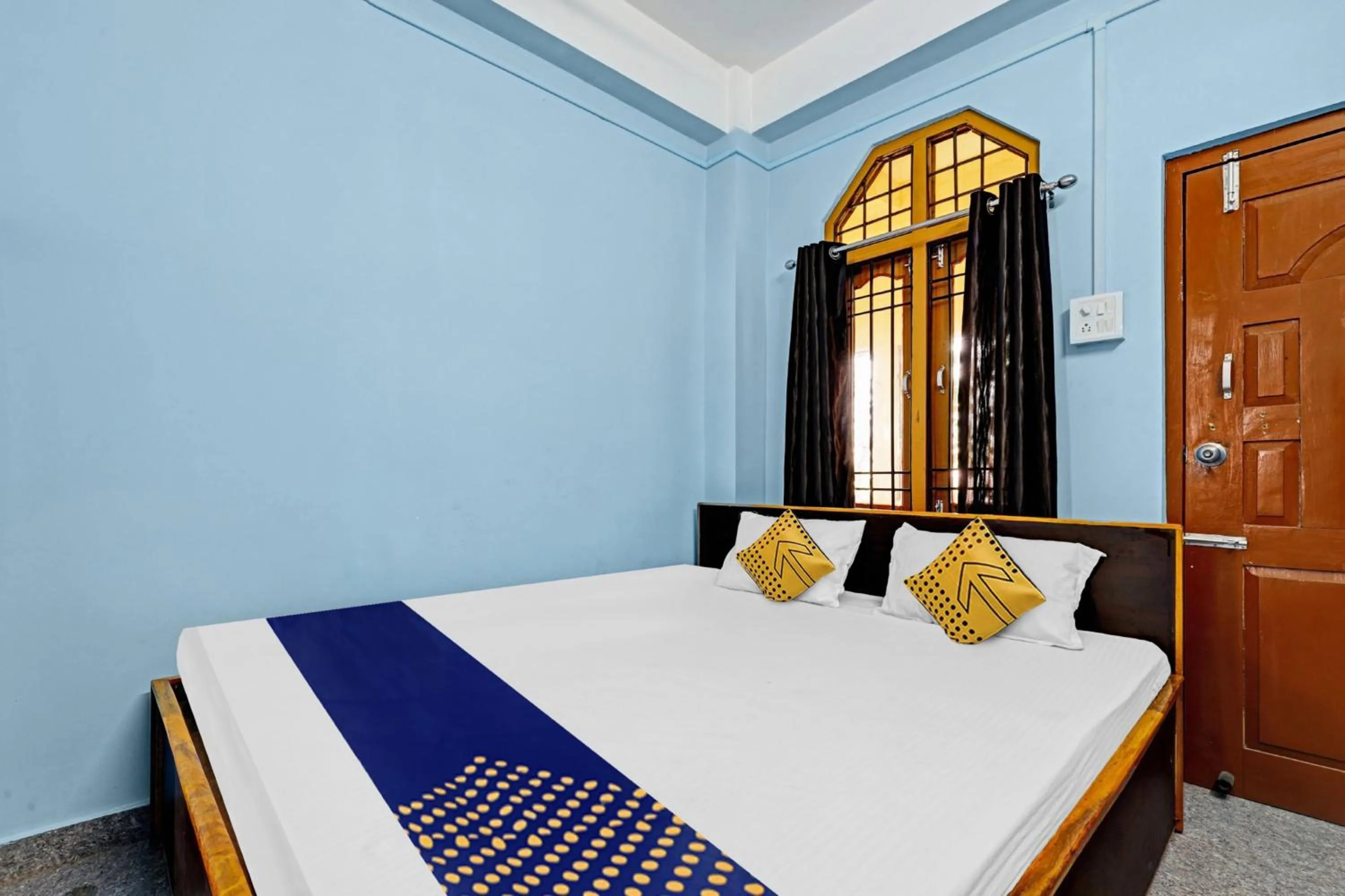 Bedroom in Hotel O Garam Masala Residency